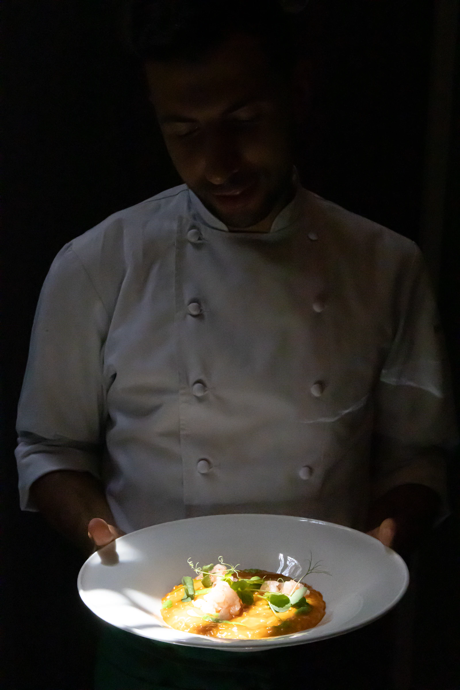 A modern plated dish with delicate garnish