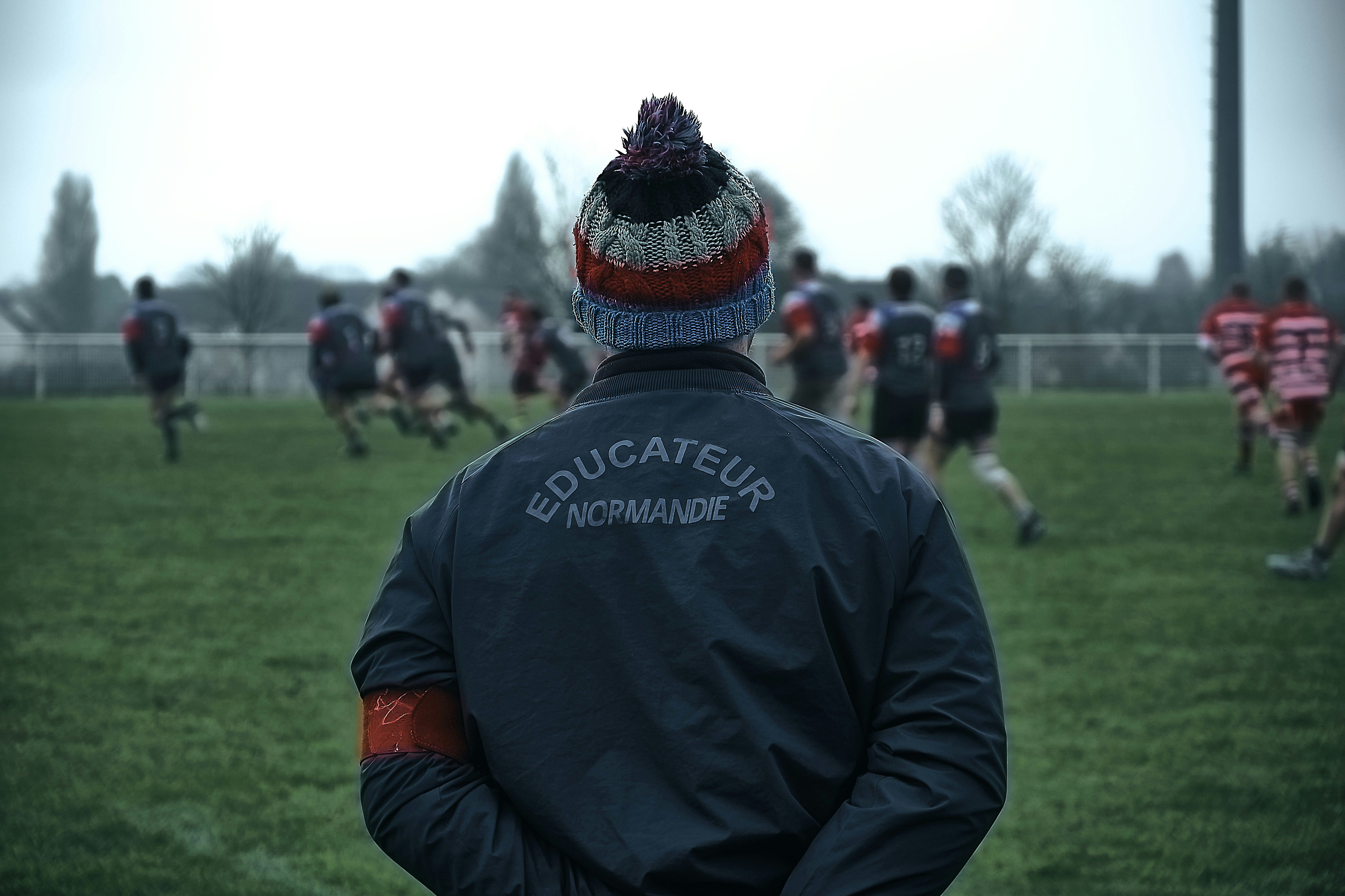 Rugby coach training athletes