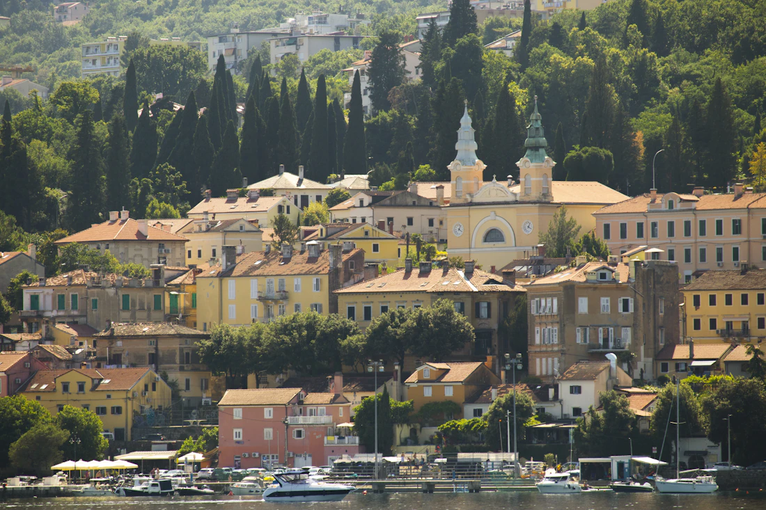 A scenic coastal town with colorful buildings on the Kvarner Gulf