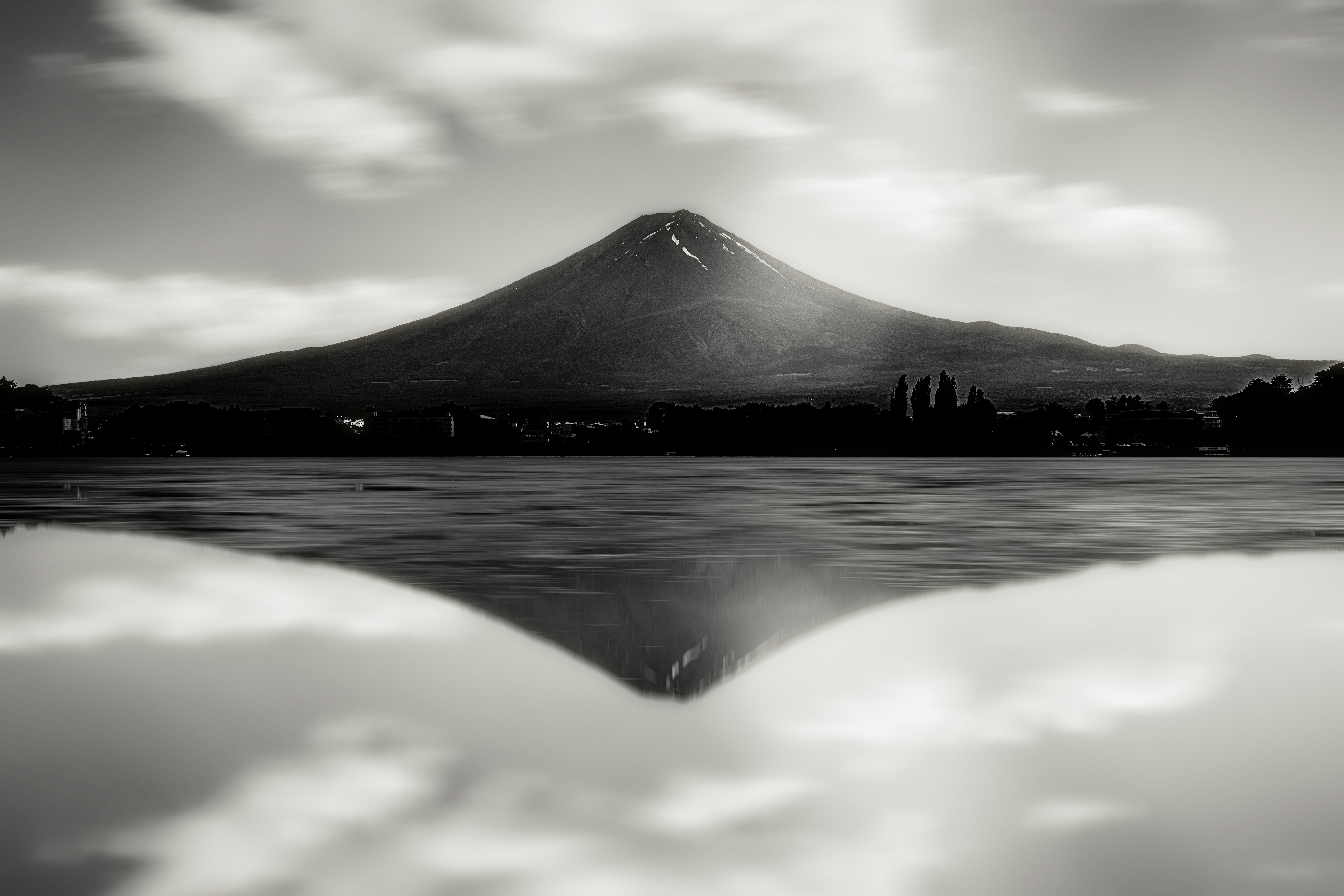 Mount fuji reflected in the still water.