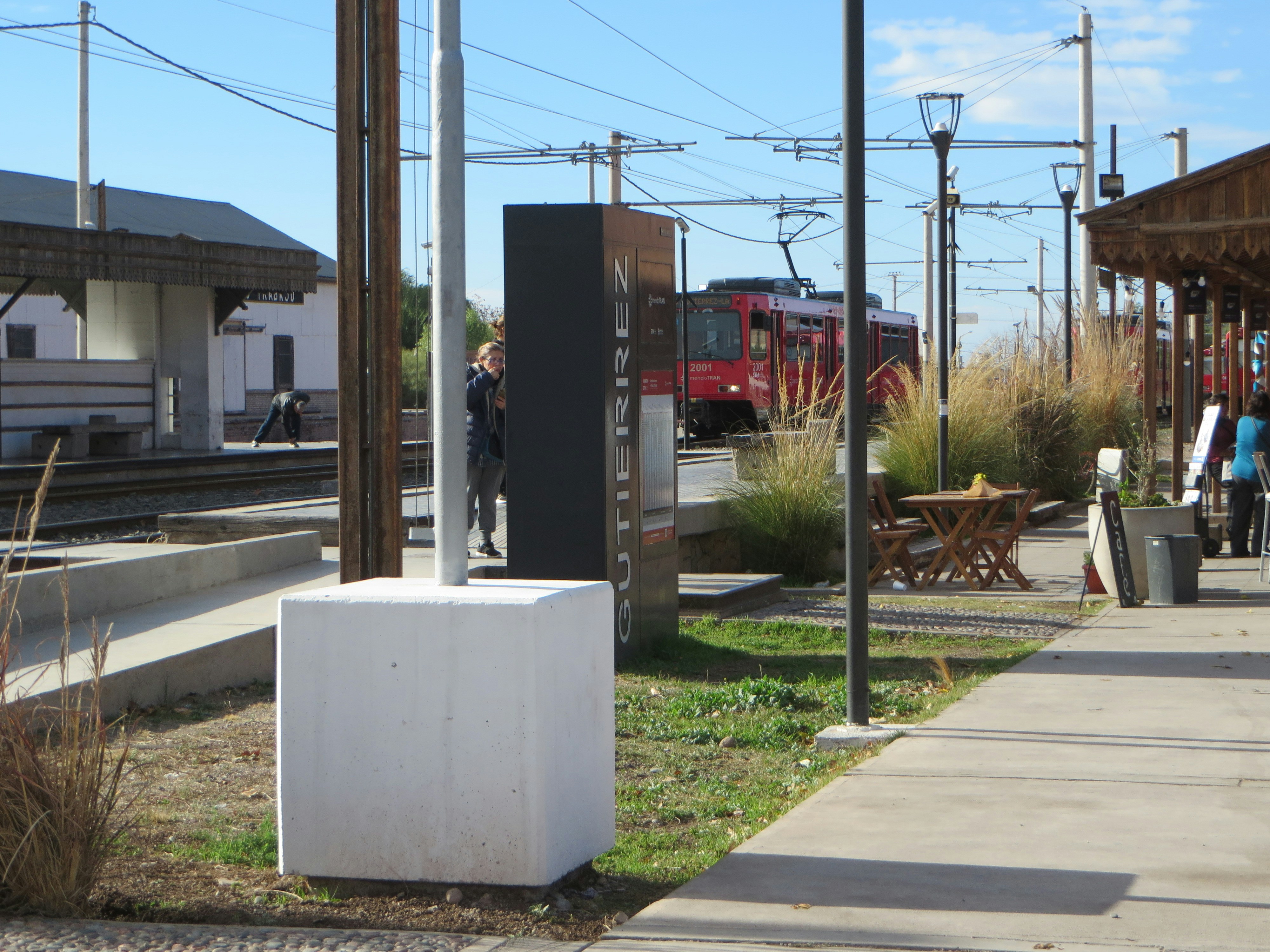 A train is approaching a station platform.
