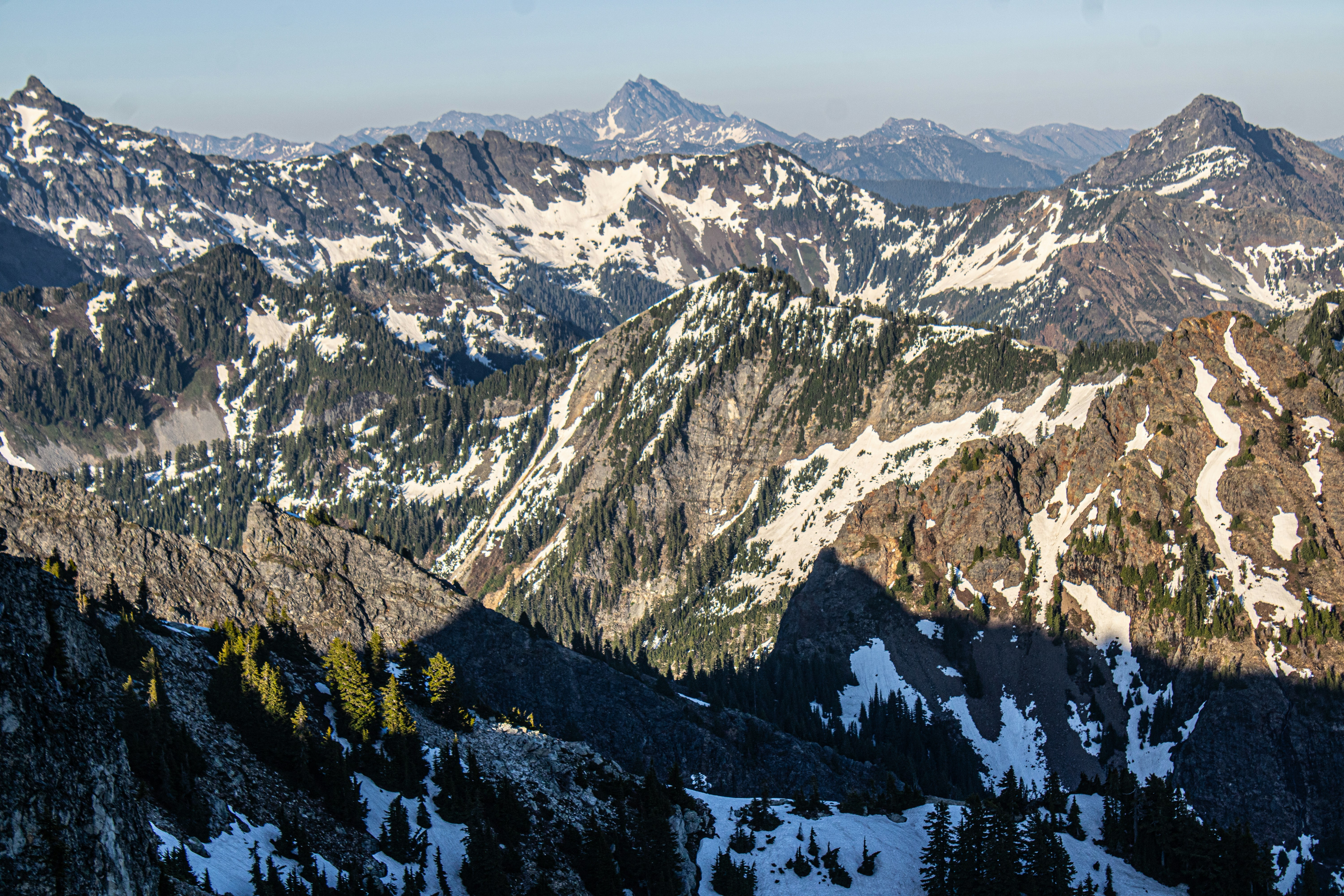 Snowy mountain peaks dominate a scenic landscape.
