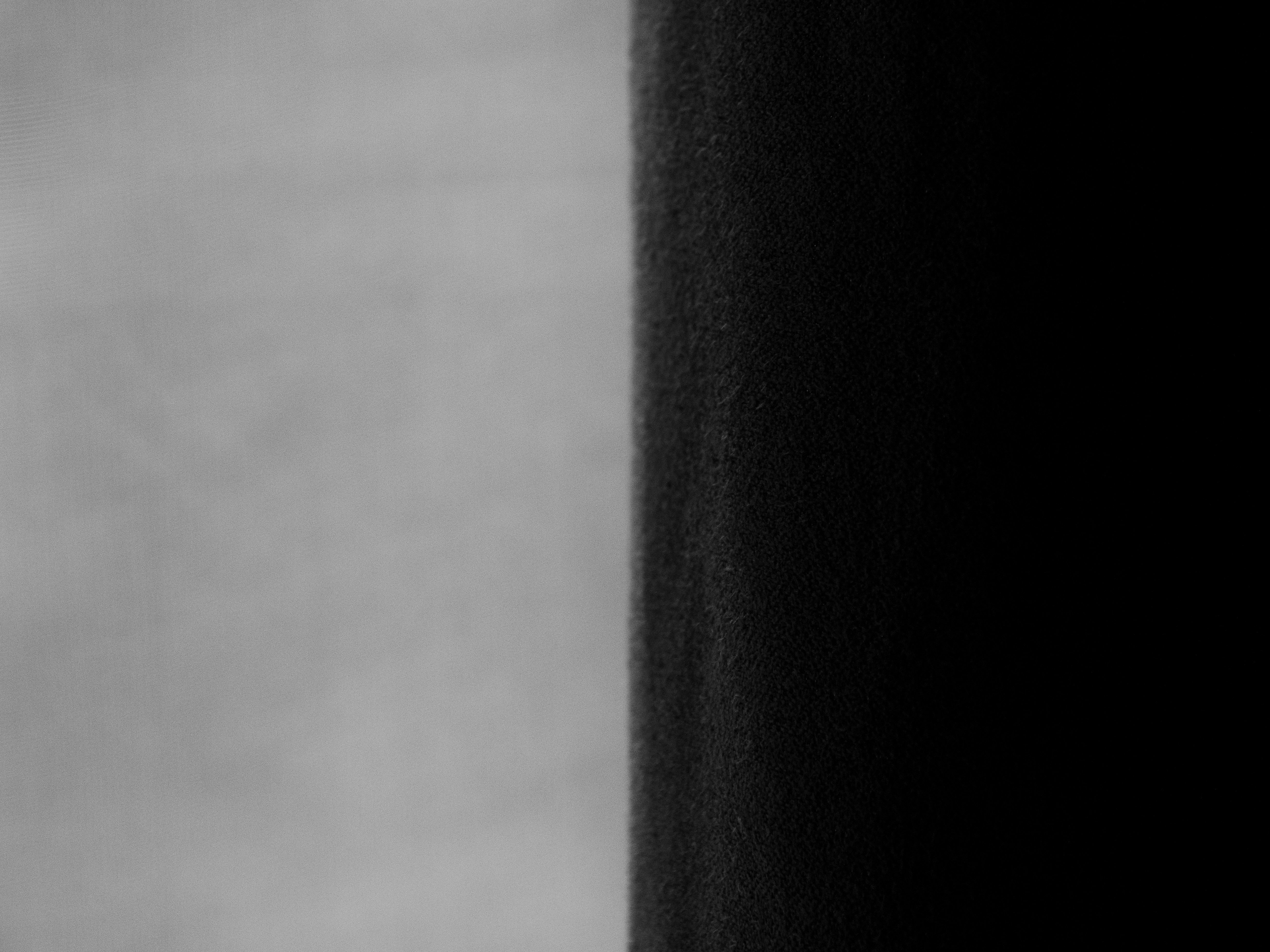 A split screen displays black and white contrast.