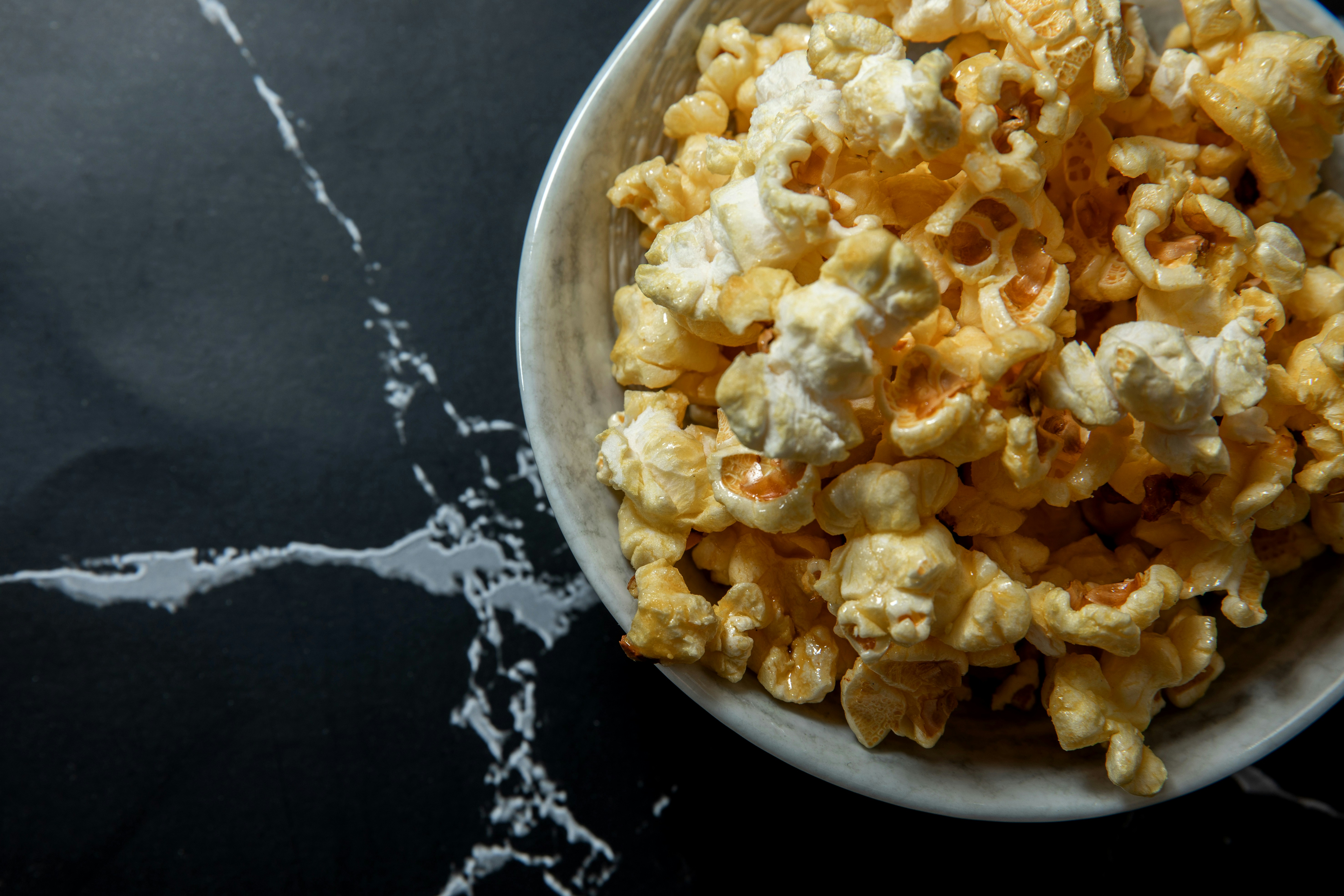 A bowl of freshly popped popcorn.