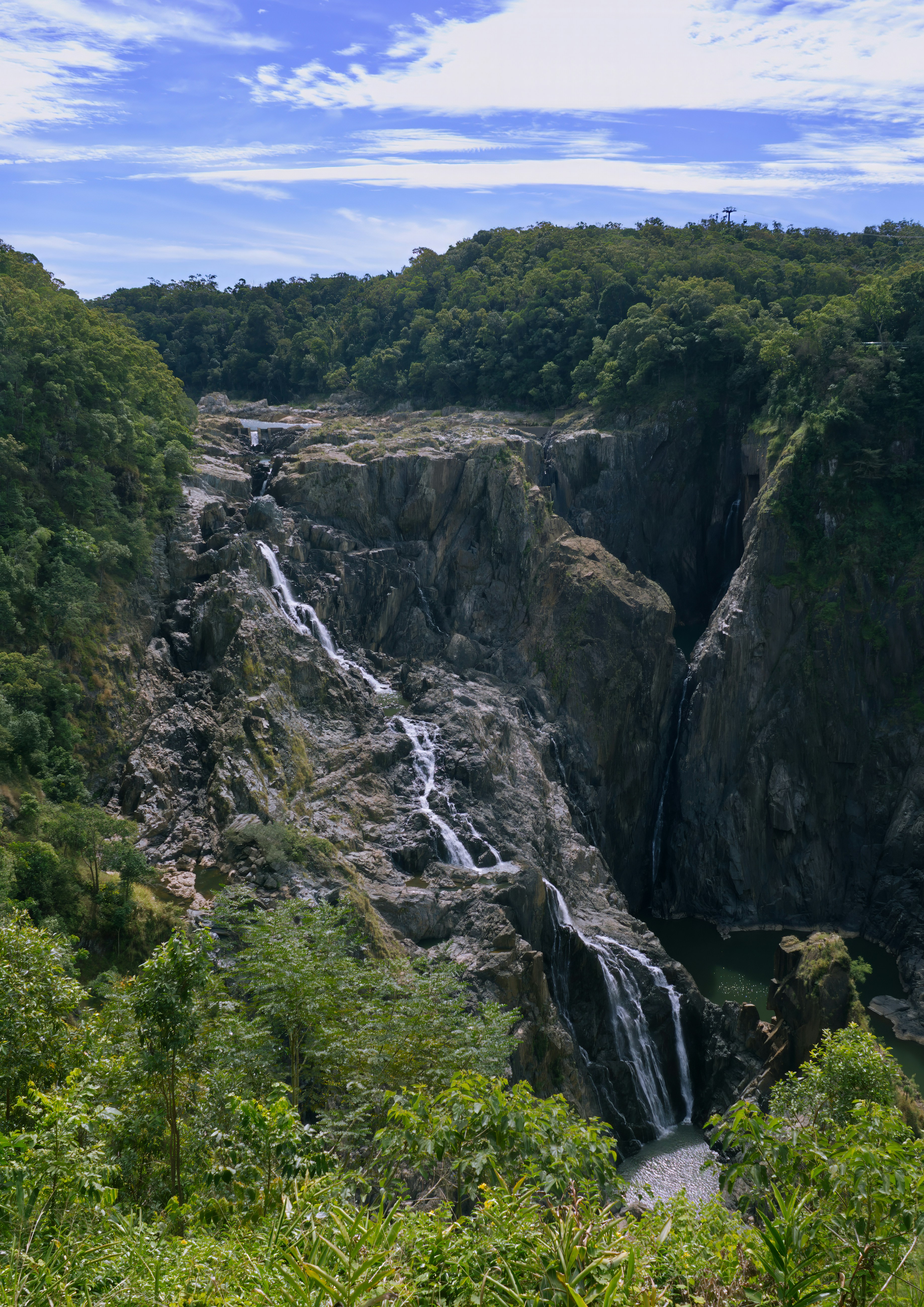 A majestic waterfall cascades down a rocky cliff.