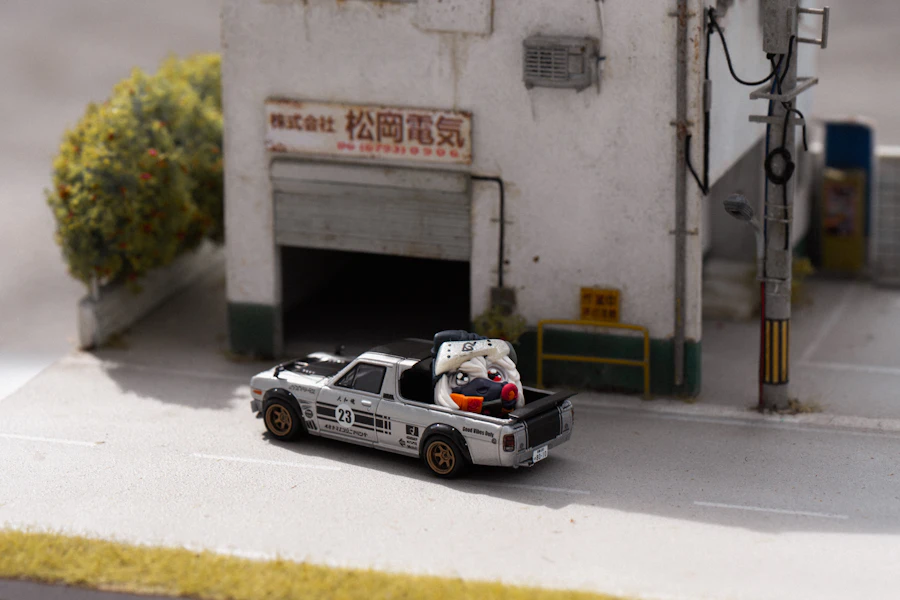 A finished scale car model on a built roadway