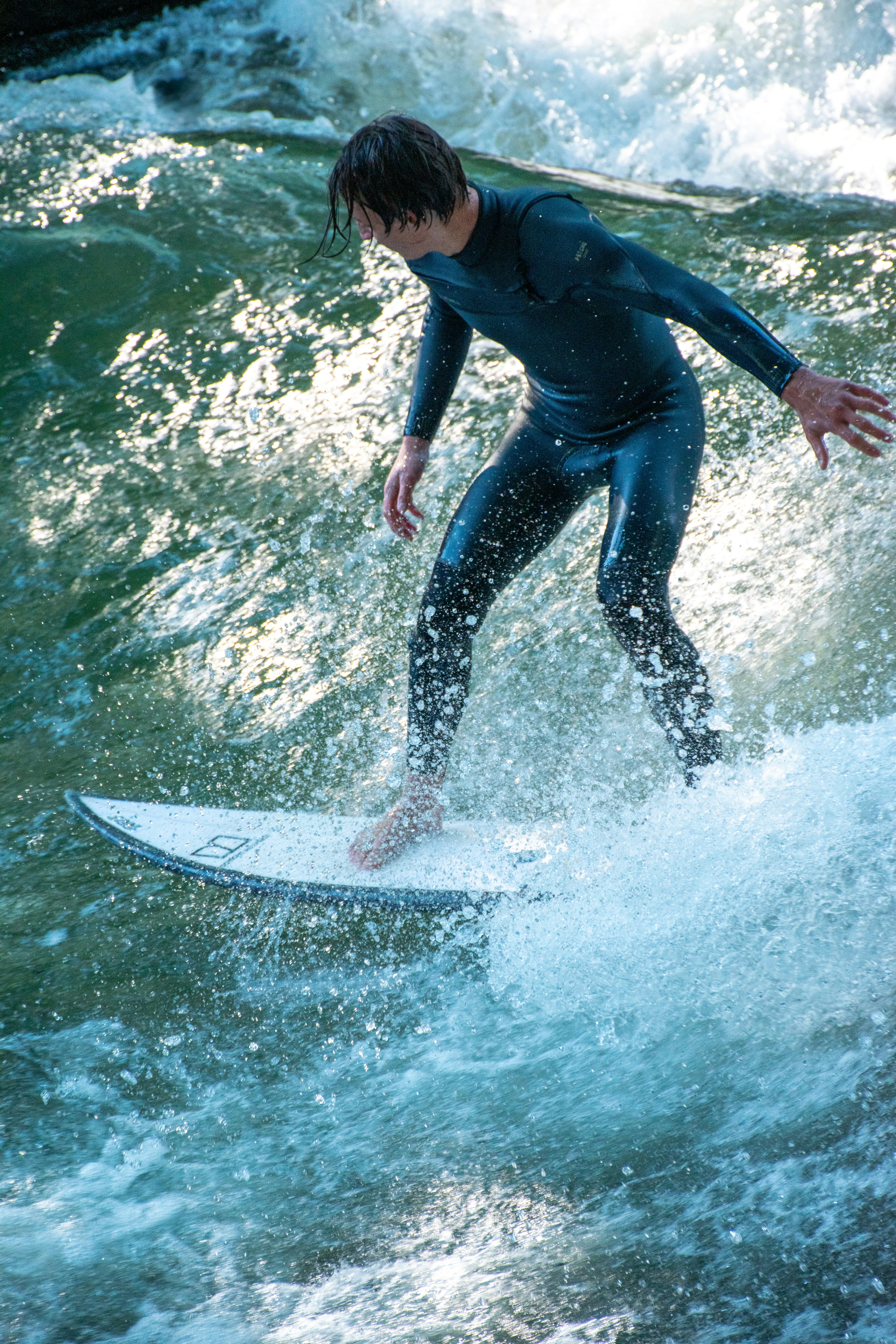 A surfer rides a wave.