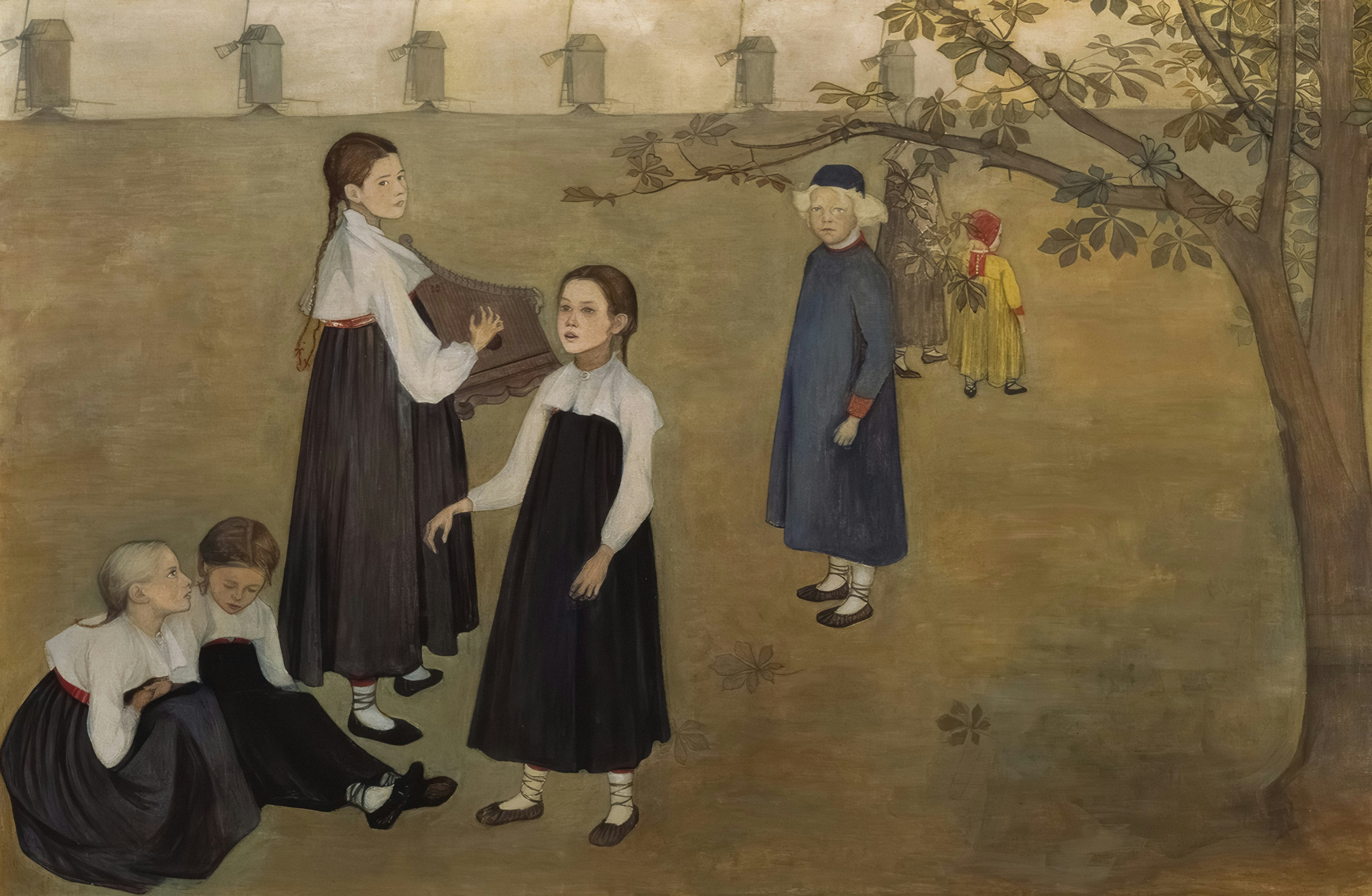 Children gathered in a grassy yard near a tree.