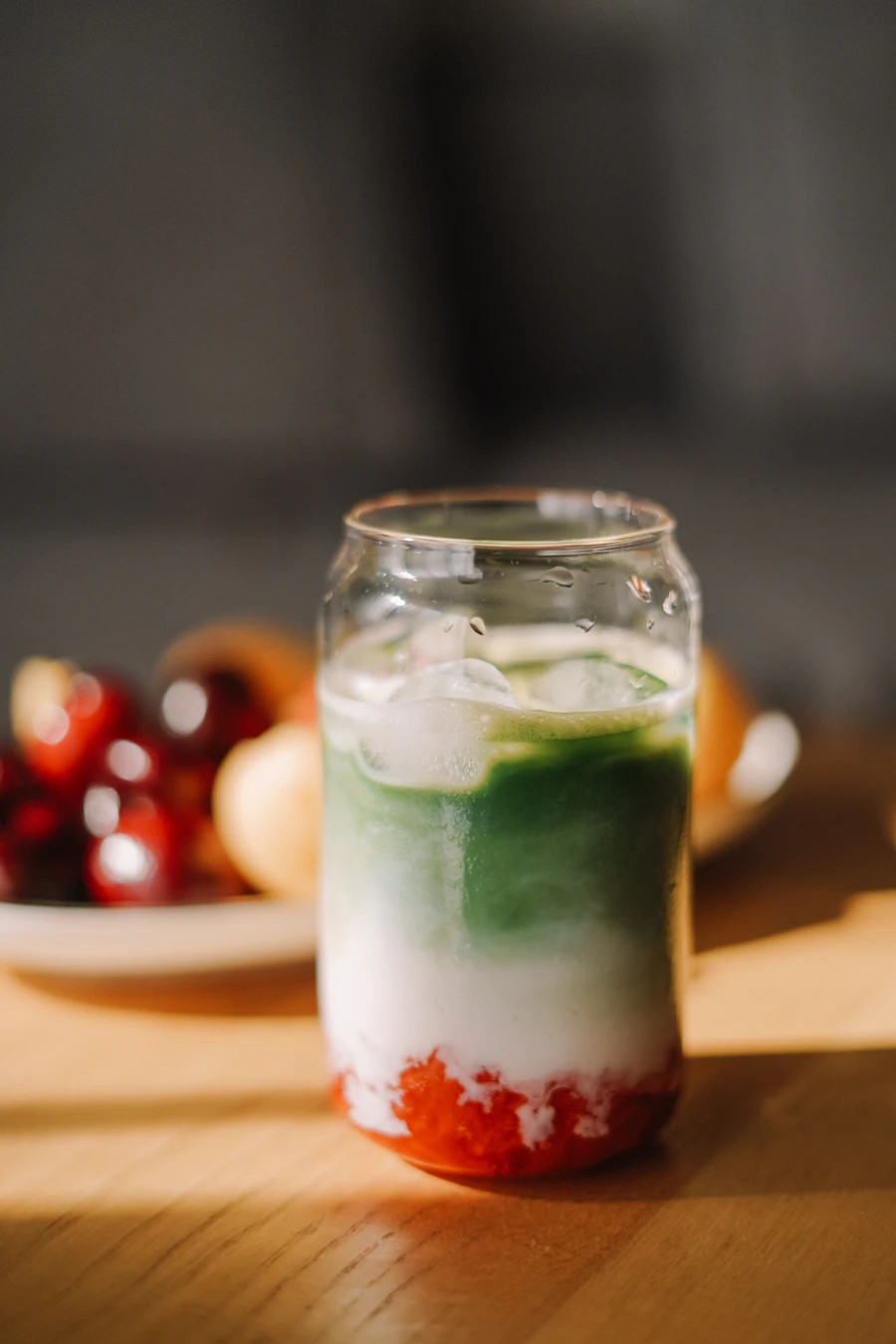 Stock photo inspiration: layered strawberry puree, milk and matcha latte