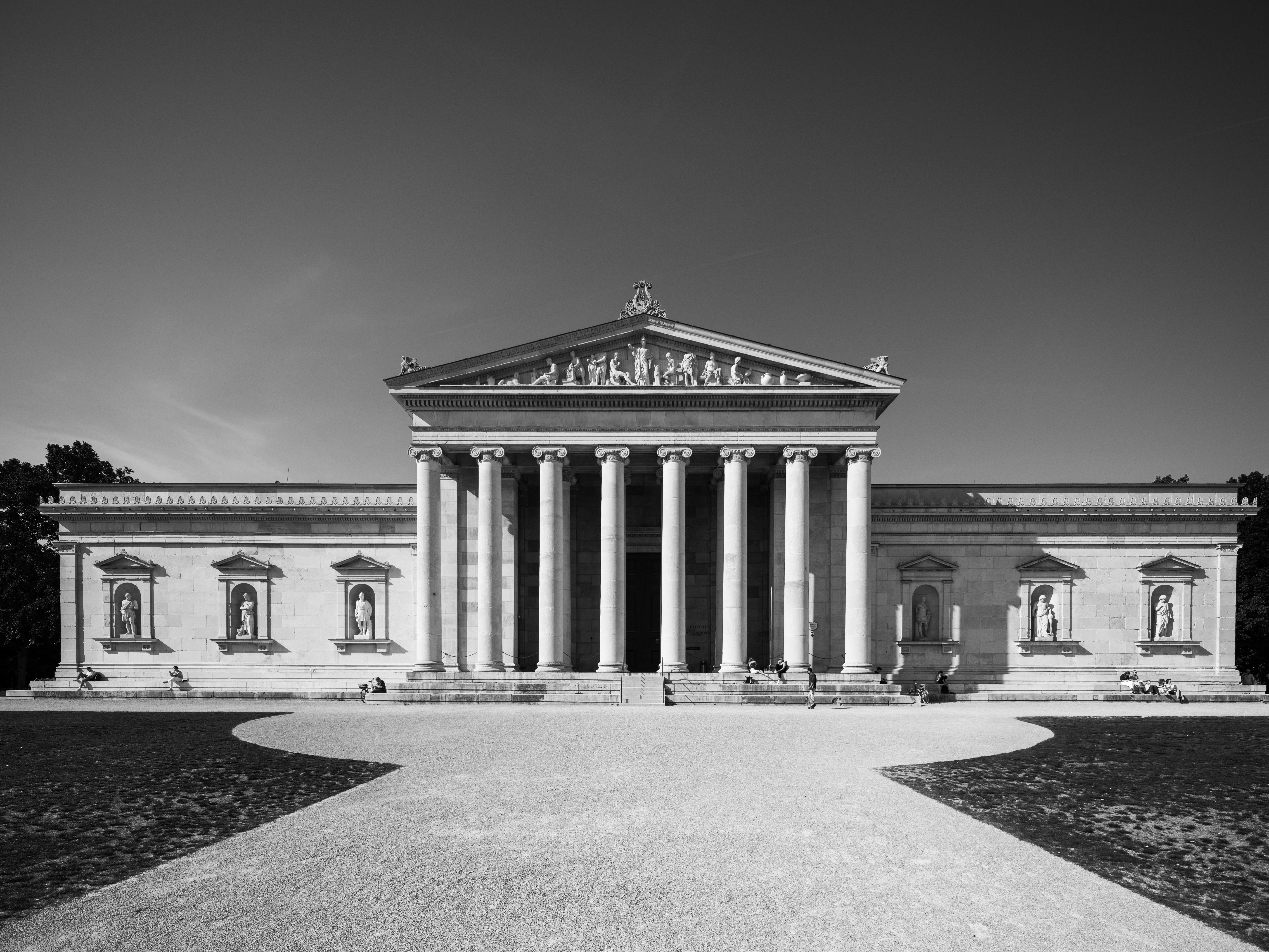 A neoclassical building with a path.