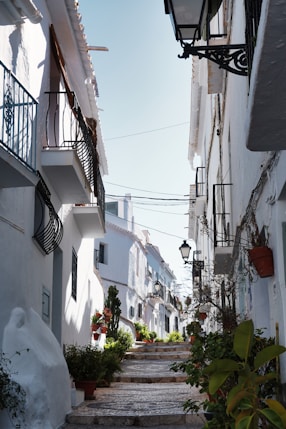 White buildings and stairs create a charming european street.