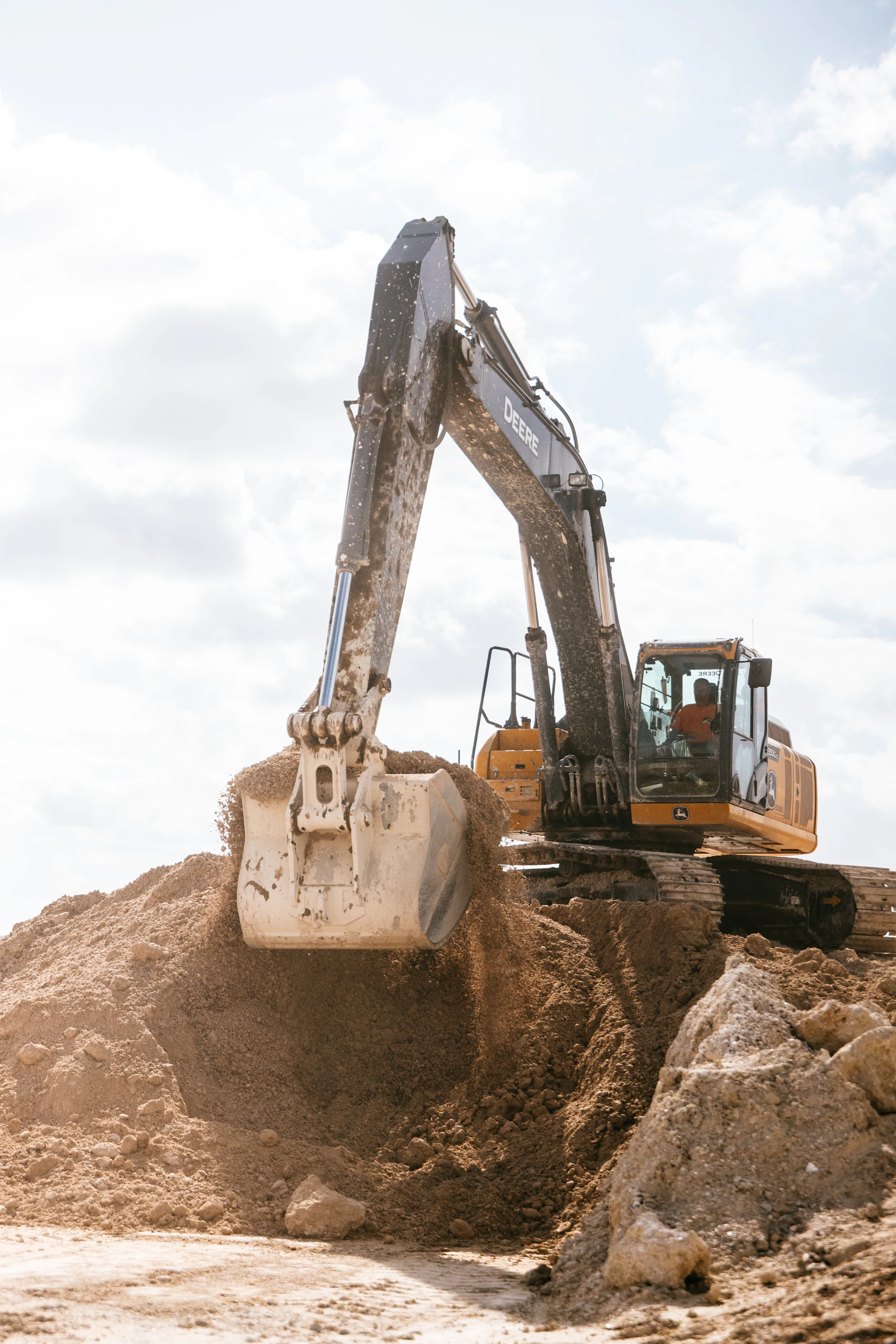 Large excavator scooping earth on a construction site