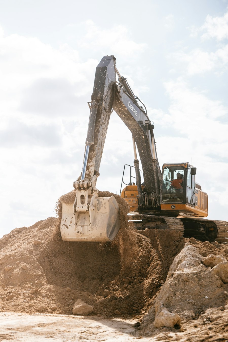 Excavator arm working a site