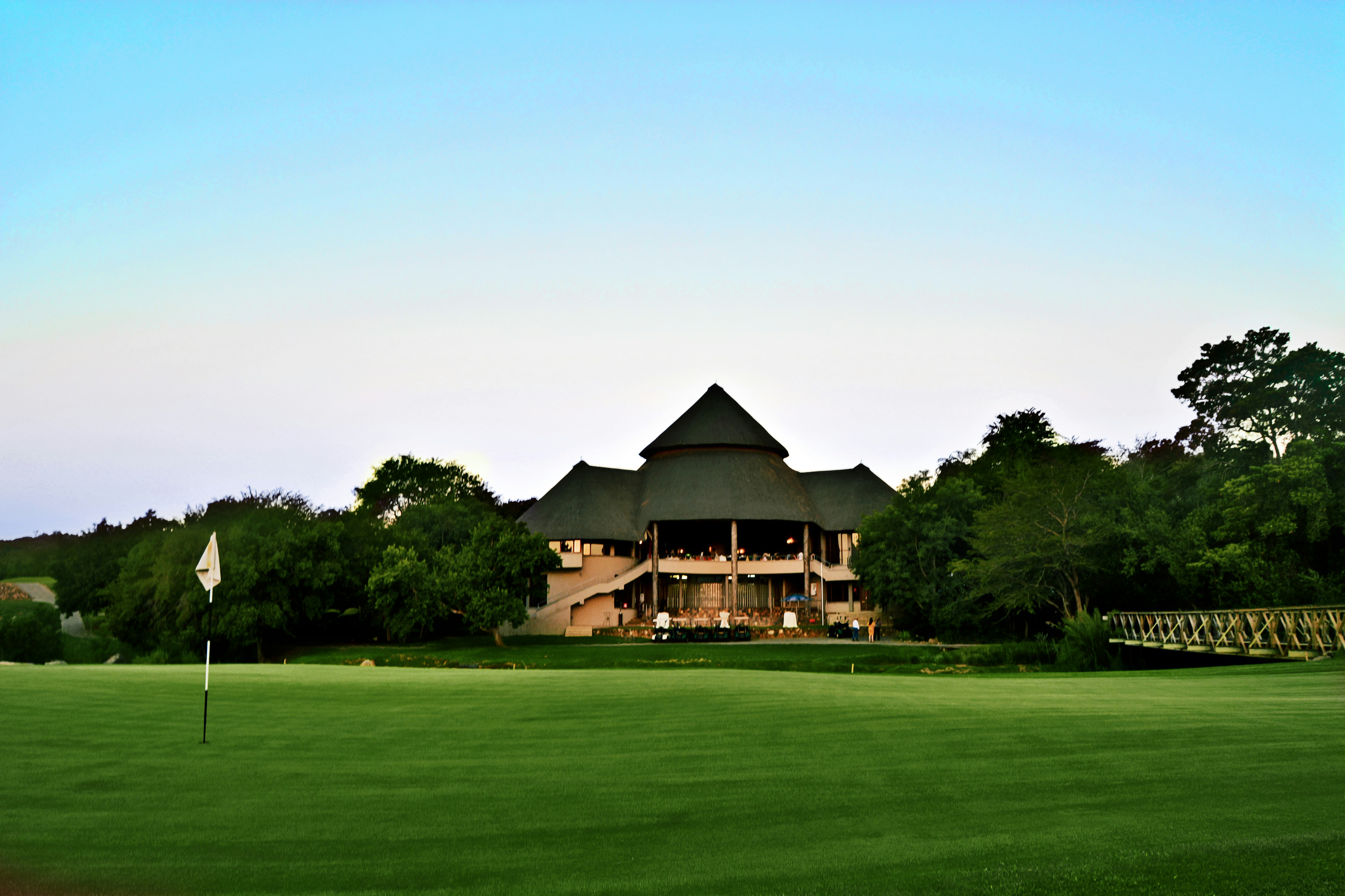 Golf course with clubhouse backdrop