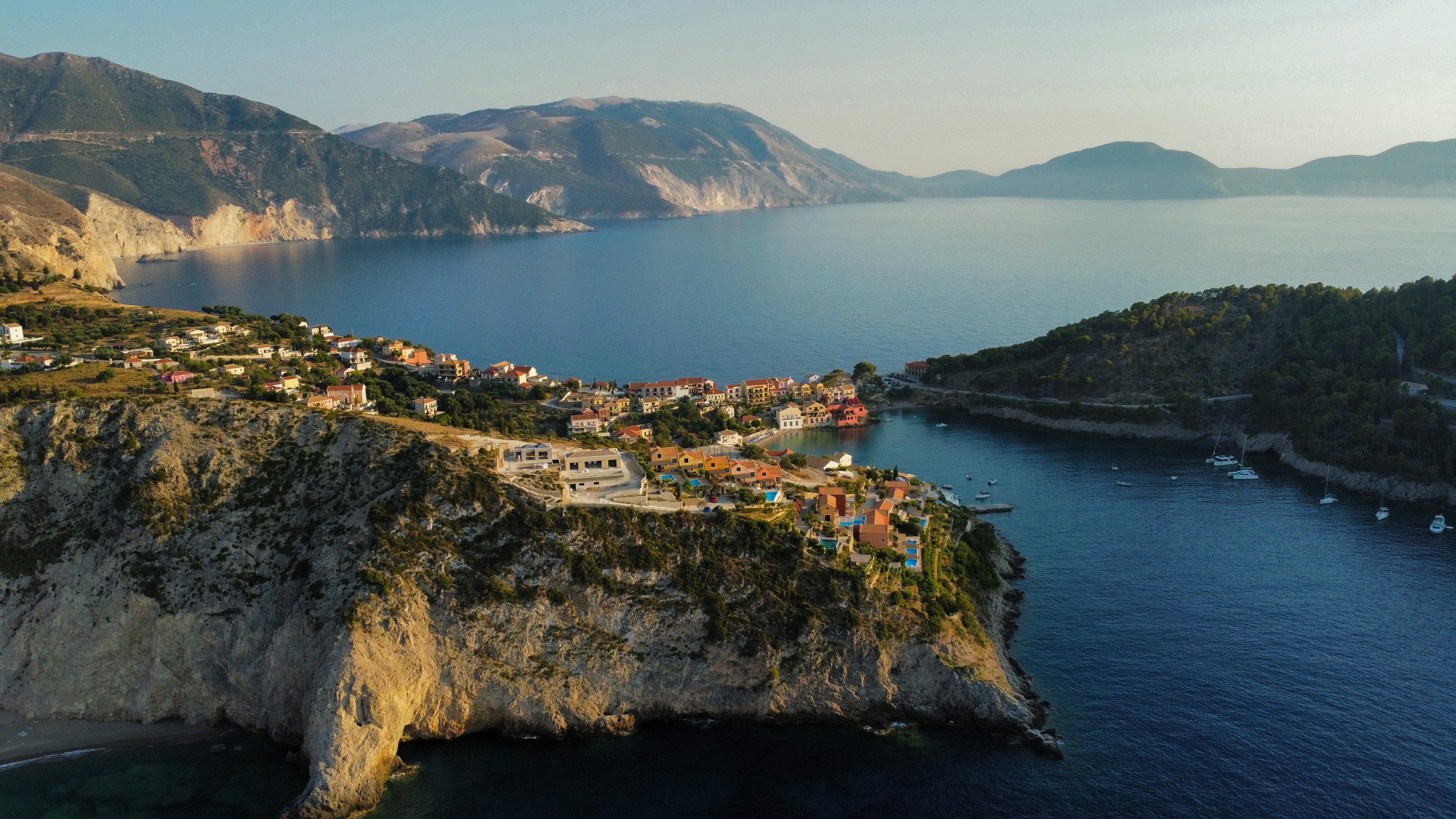 Coastal village nestled between cliffs and the sea.