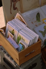 Artwork is displayed in a wooden crate.