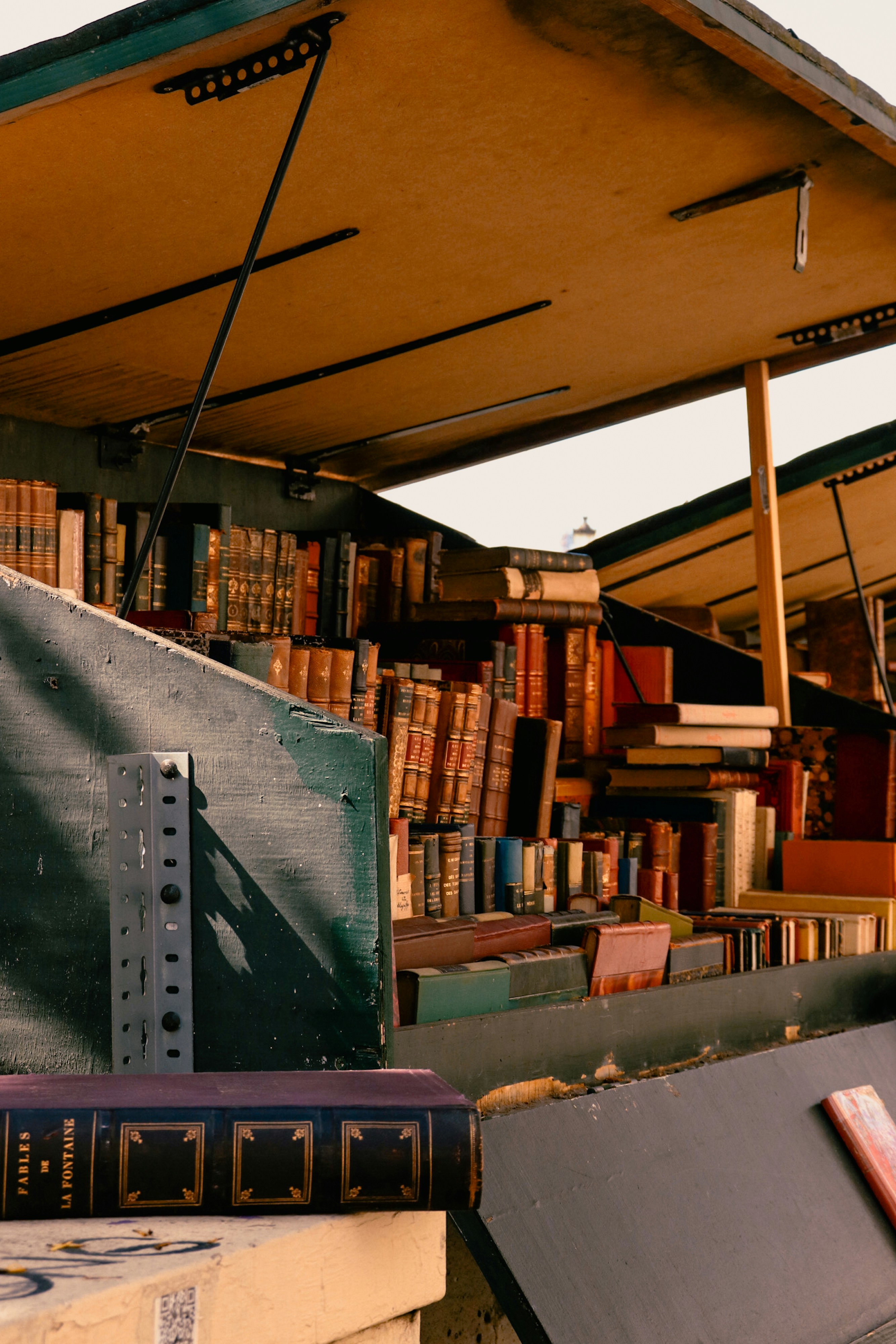 Books are displayed at a charming outdoor book stall.