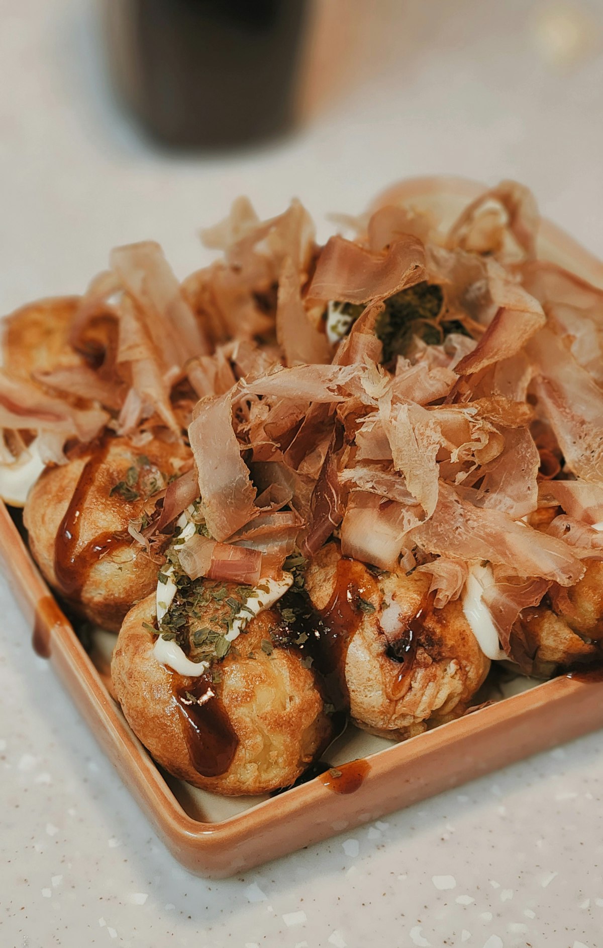 Takoyaki — Osaka's famous octopus balls freshly made in a traditional iron mold pan