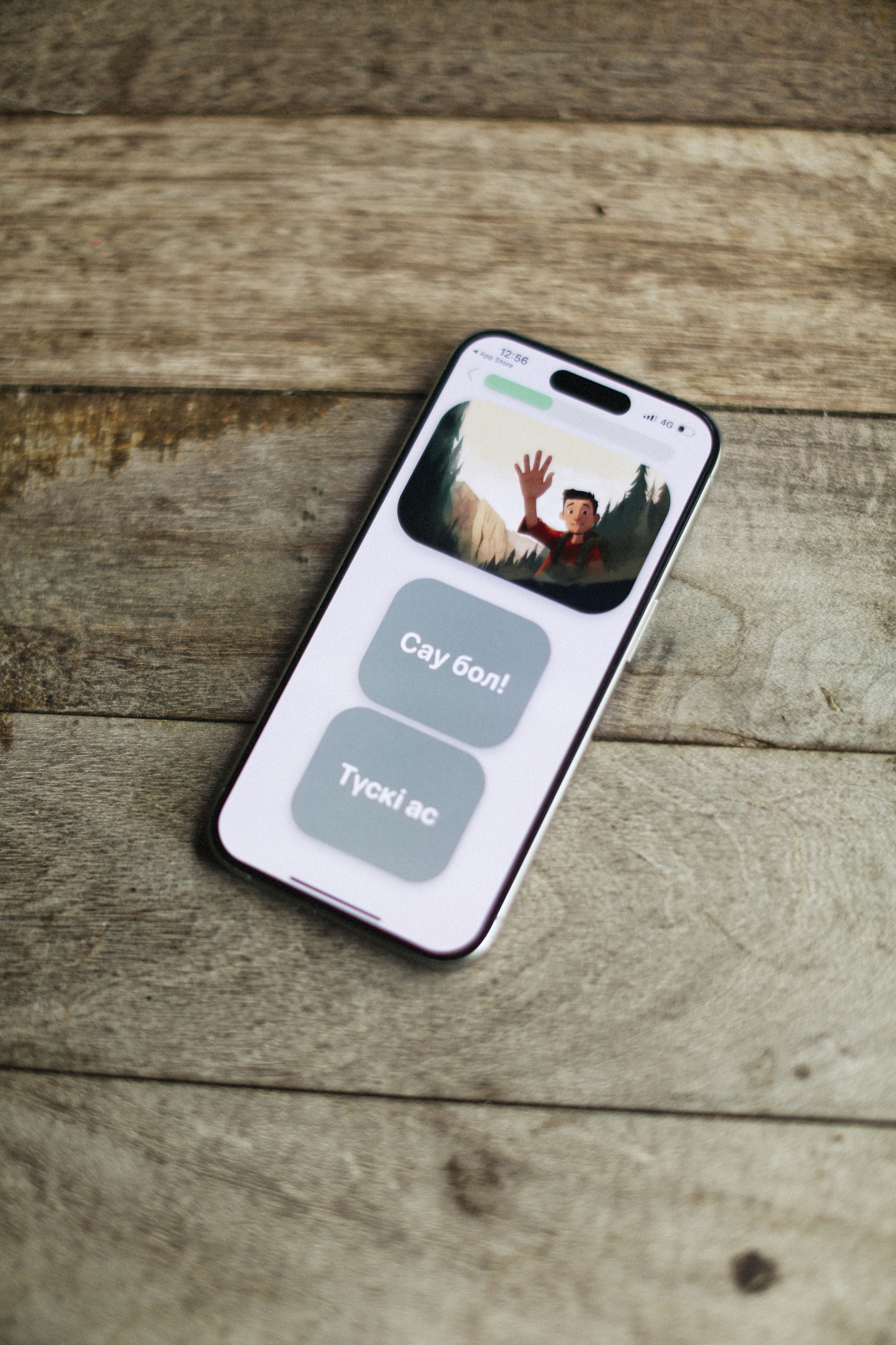 Smartphone shows a screen with buttons and a picture