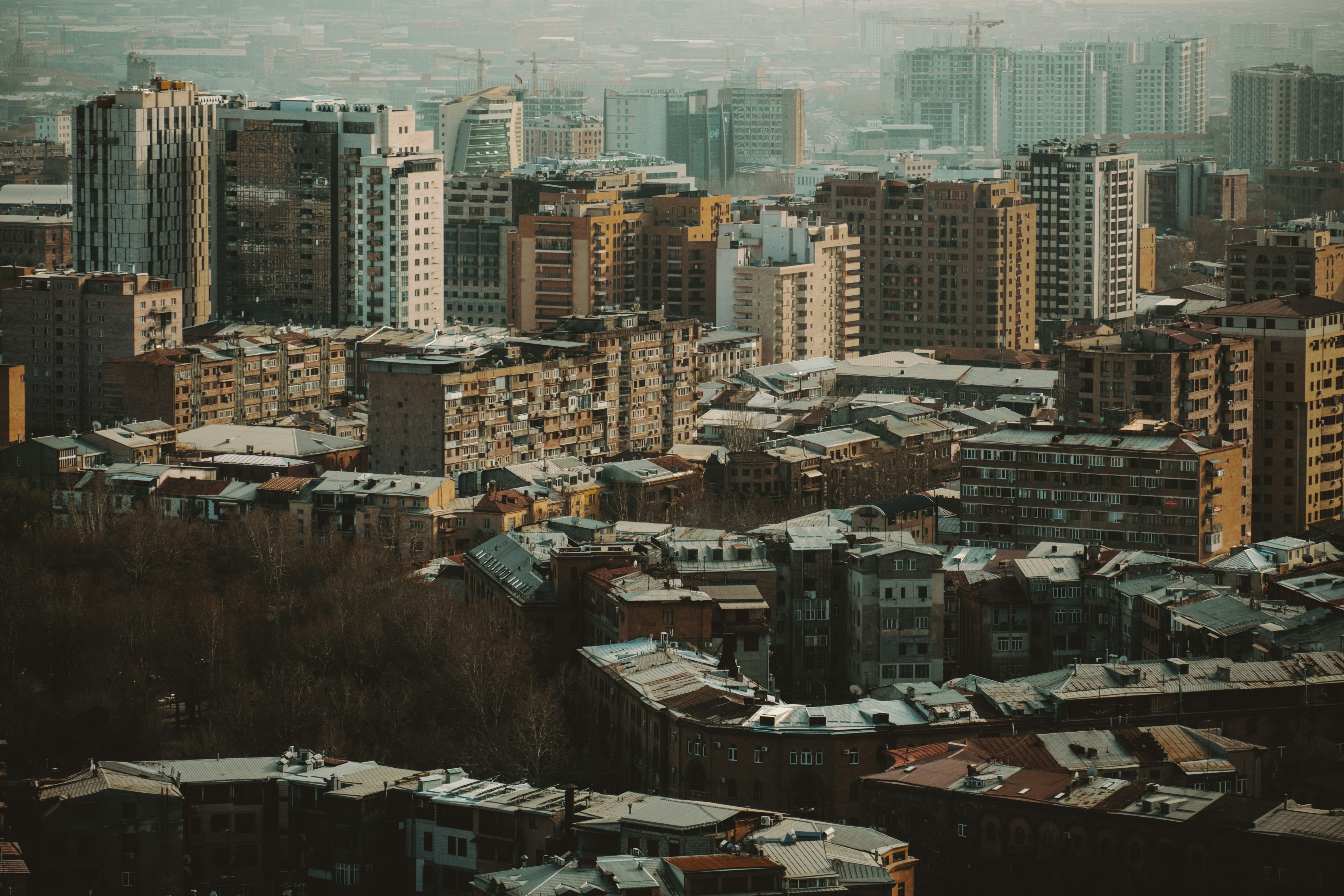 A cityscape view showcases numerous buildings.