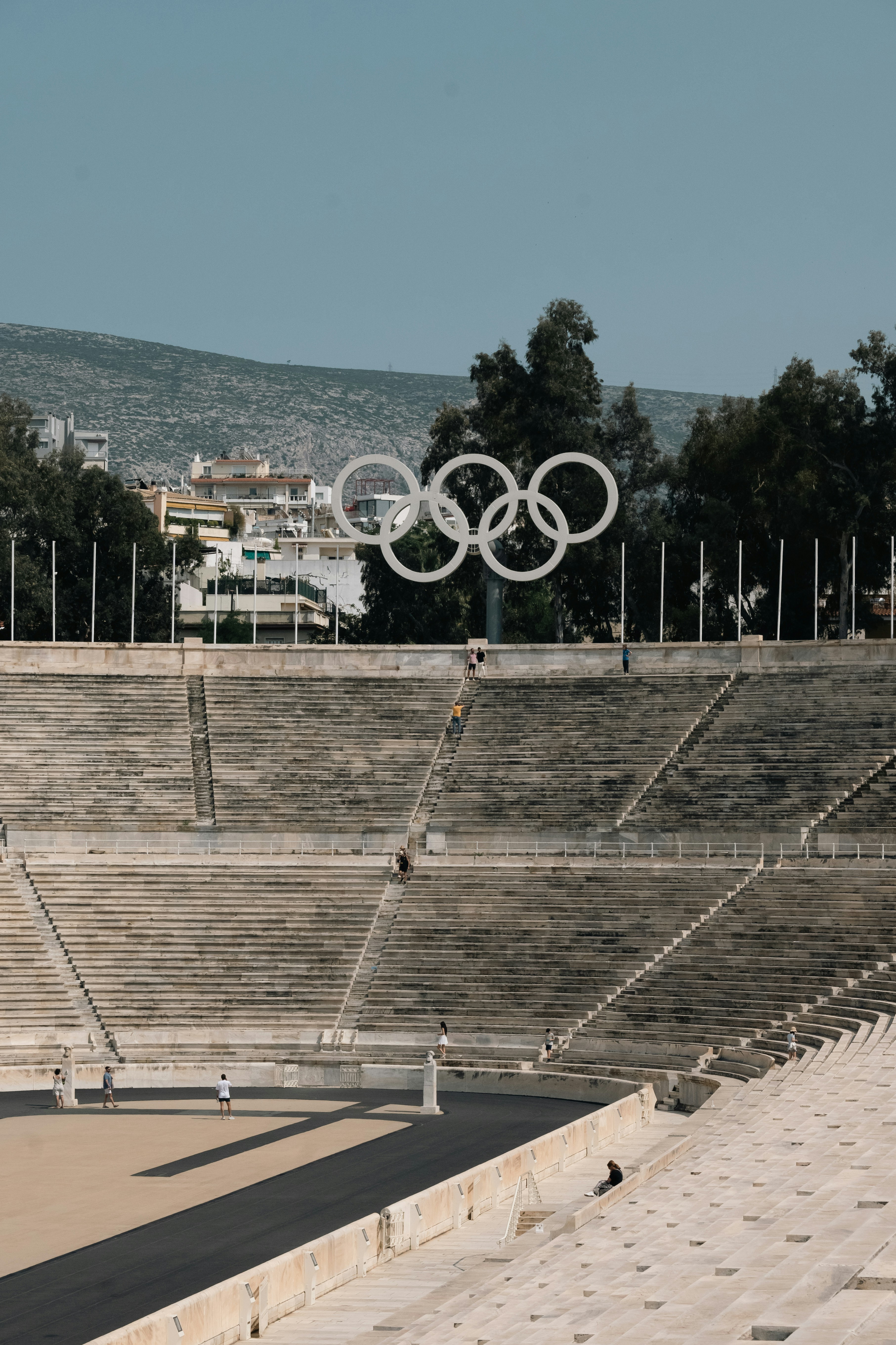 The olympic rings and a stadium in athens.
