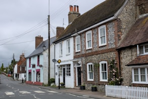 A row of quaint buildings lines a street.