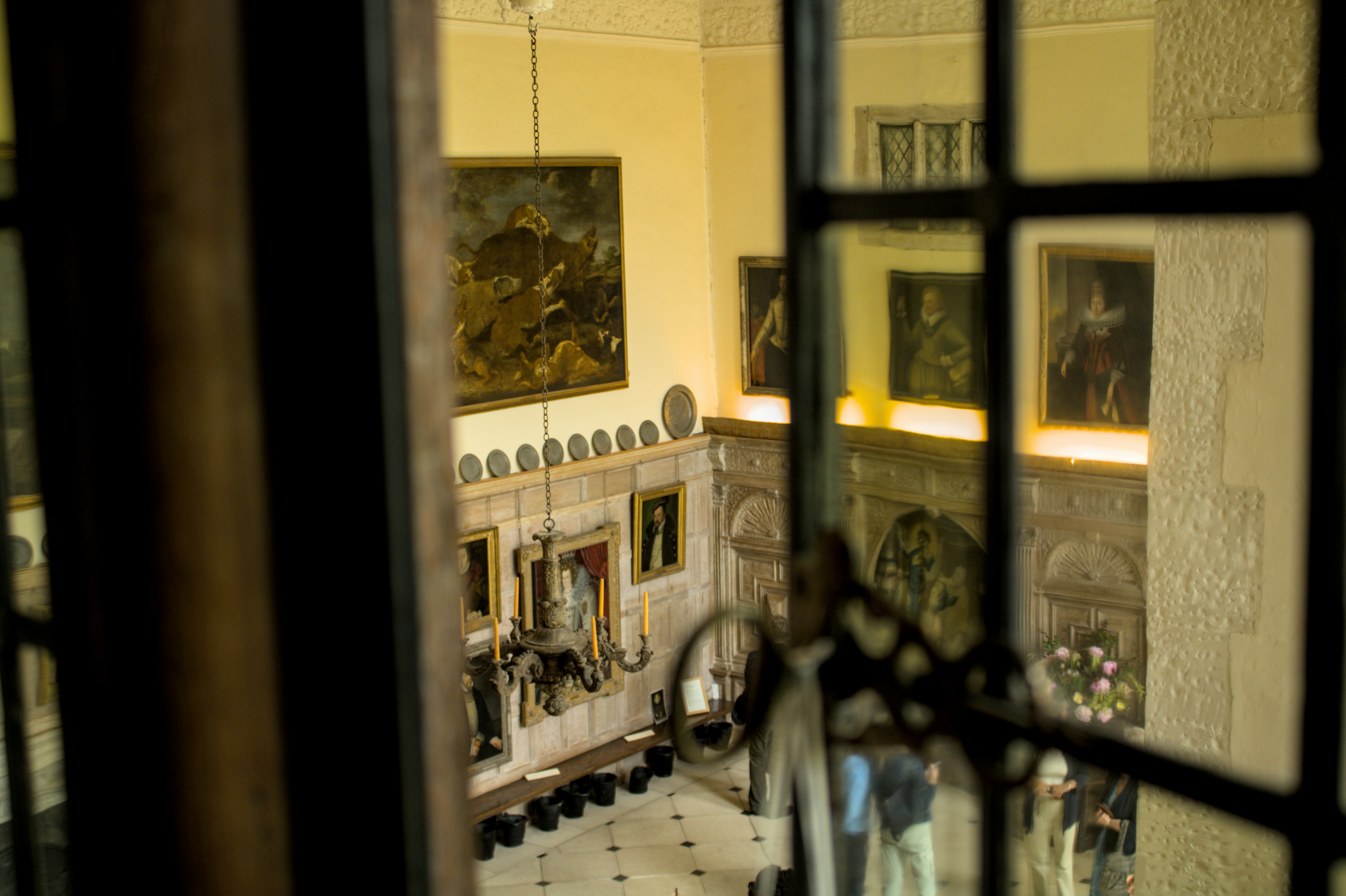 Historic Museum Room Viewed Through Iron-Framed Window