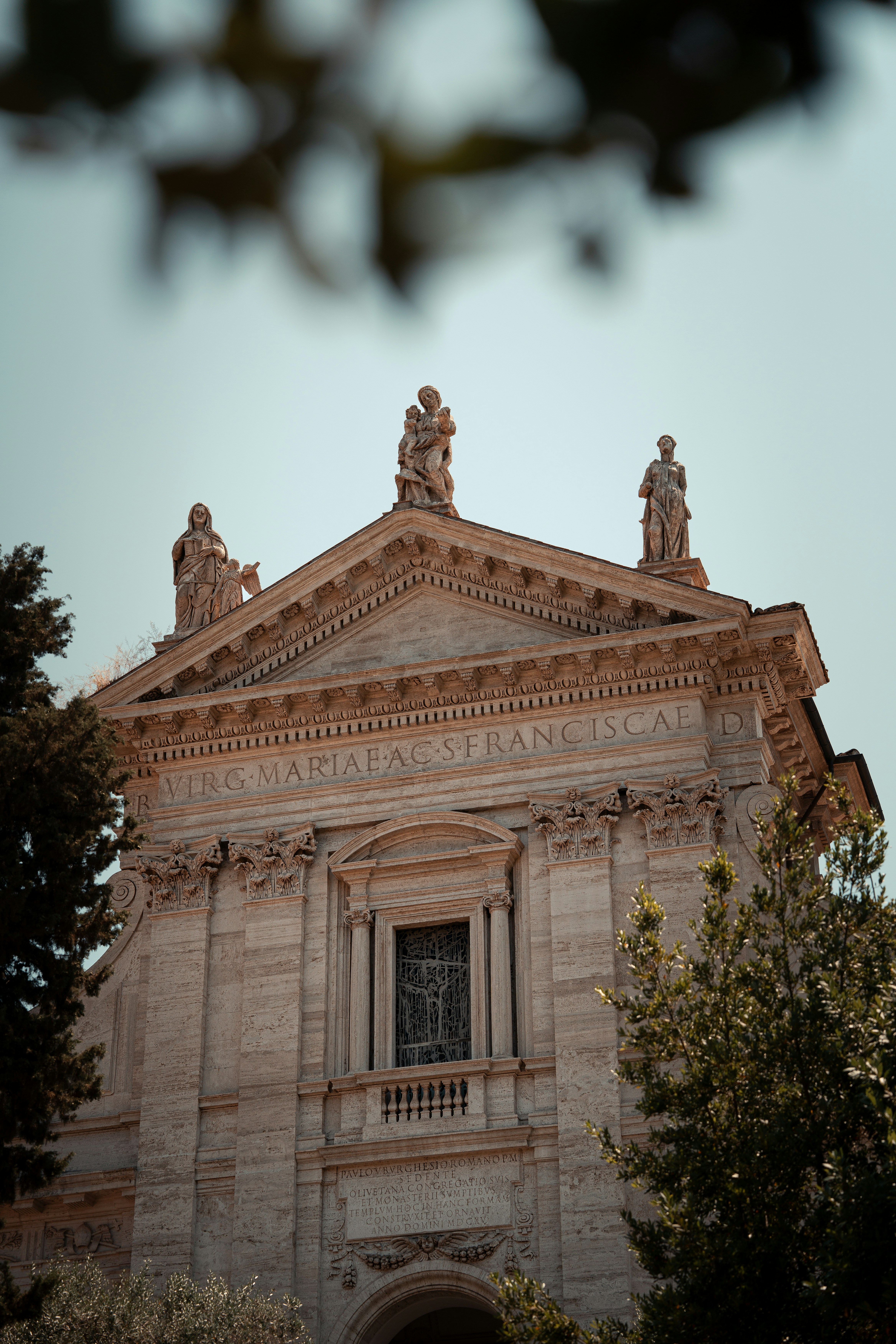 A beautiful roman church building stands tall.