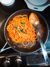 Pasta in tomato sauce with fresh basil.
