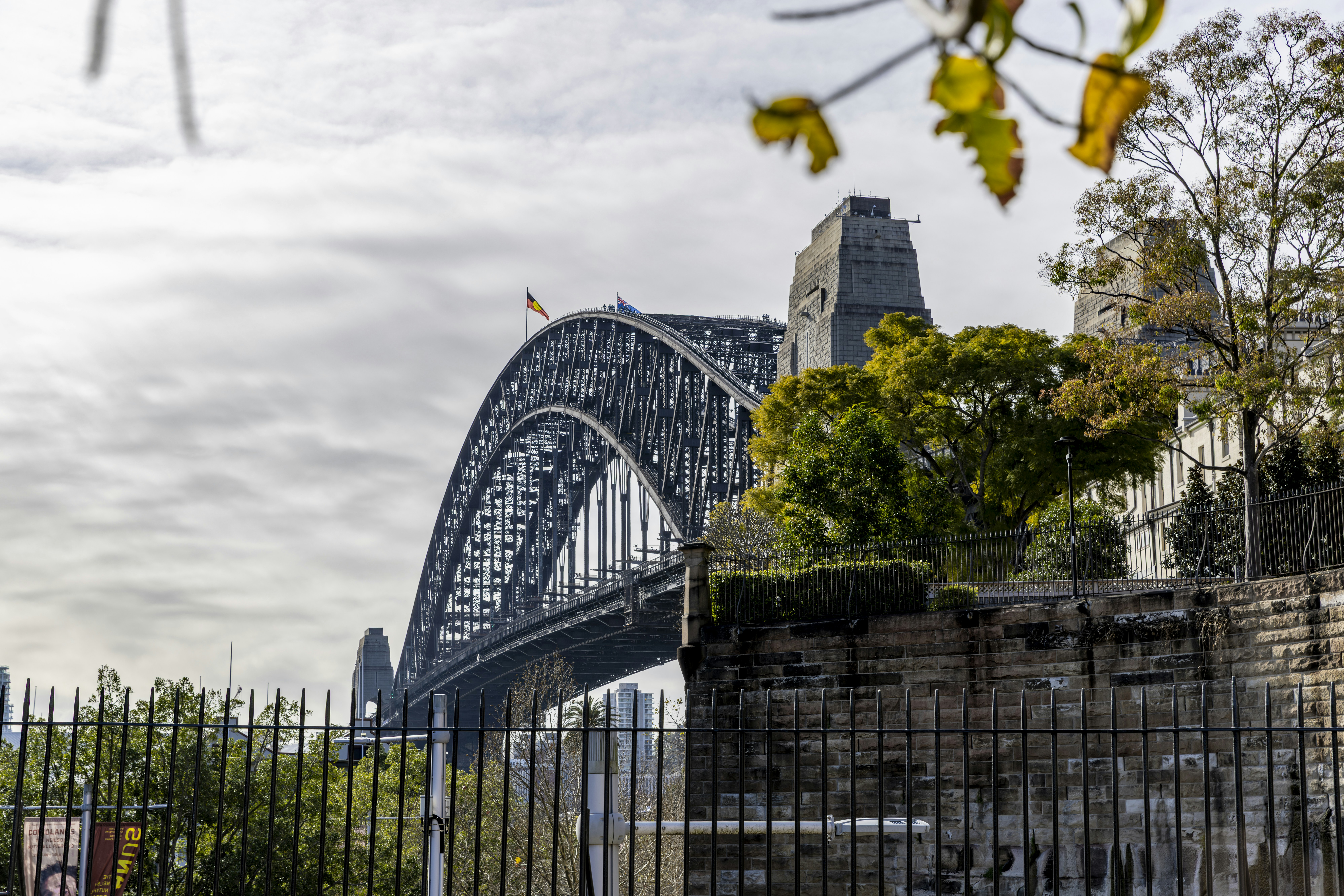The sydney harbour bridge stands majestically in the distance.