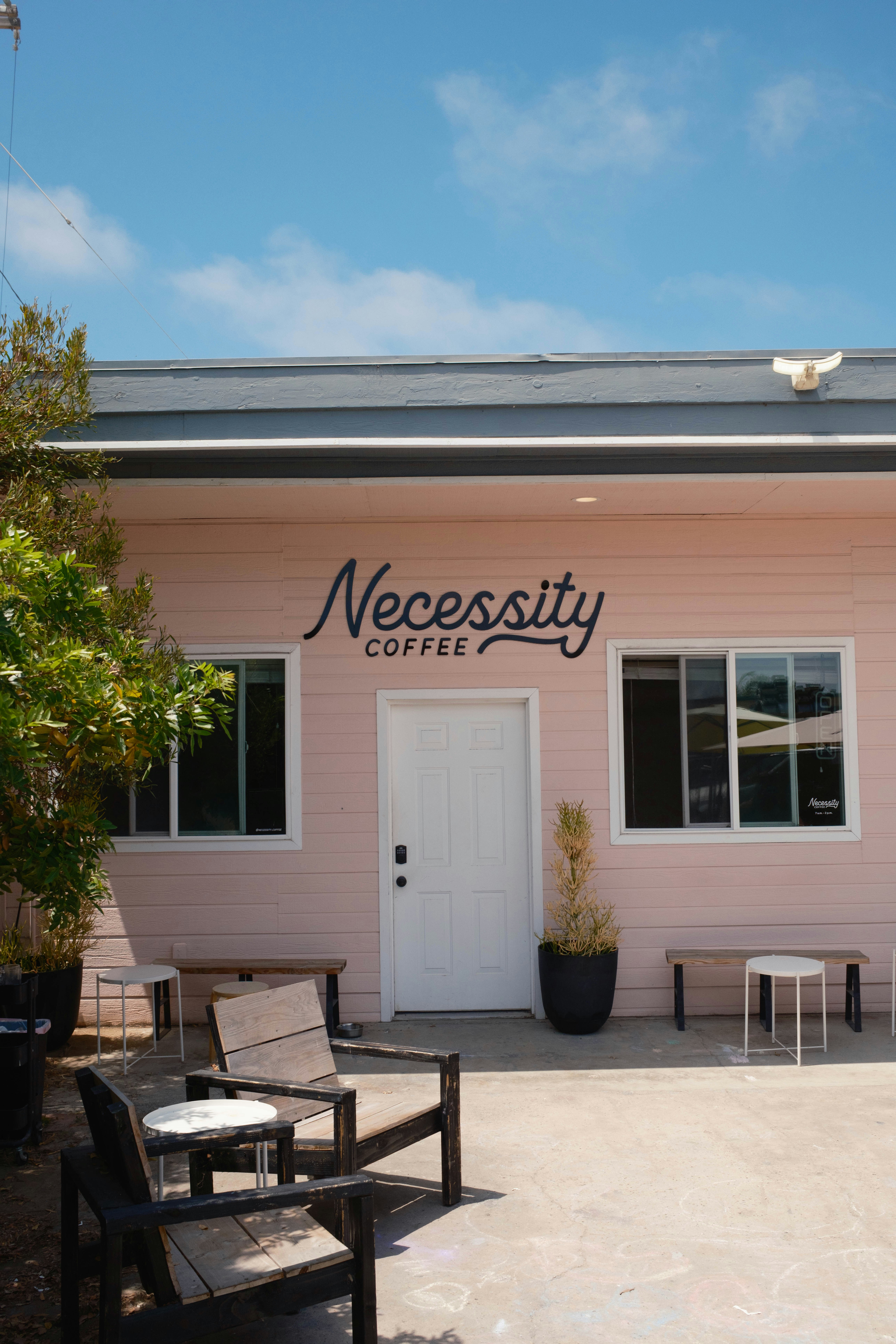 A pink coffee shop called necessity.