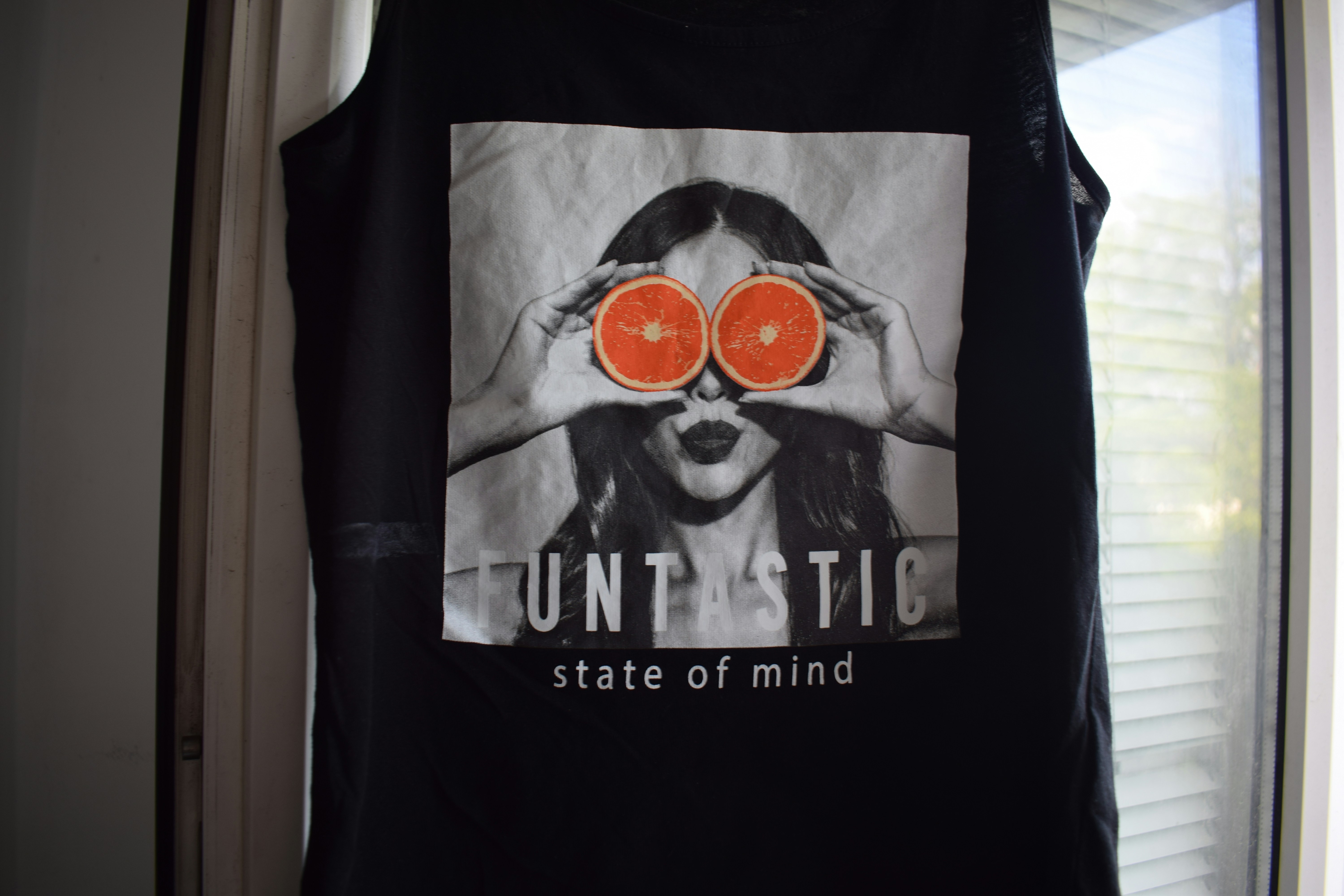 A black shirt with a unique printed design.