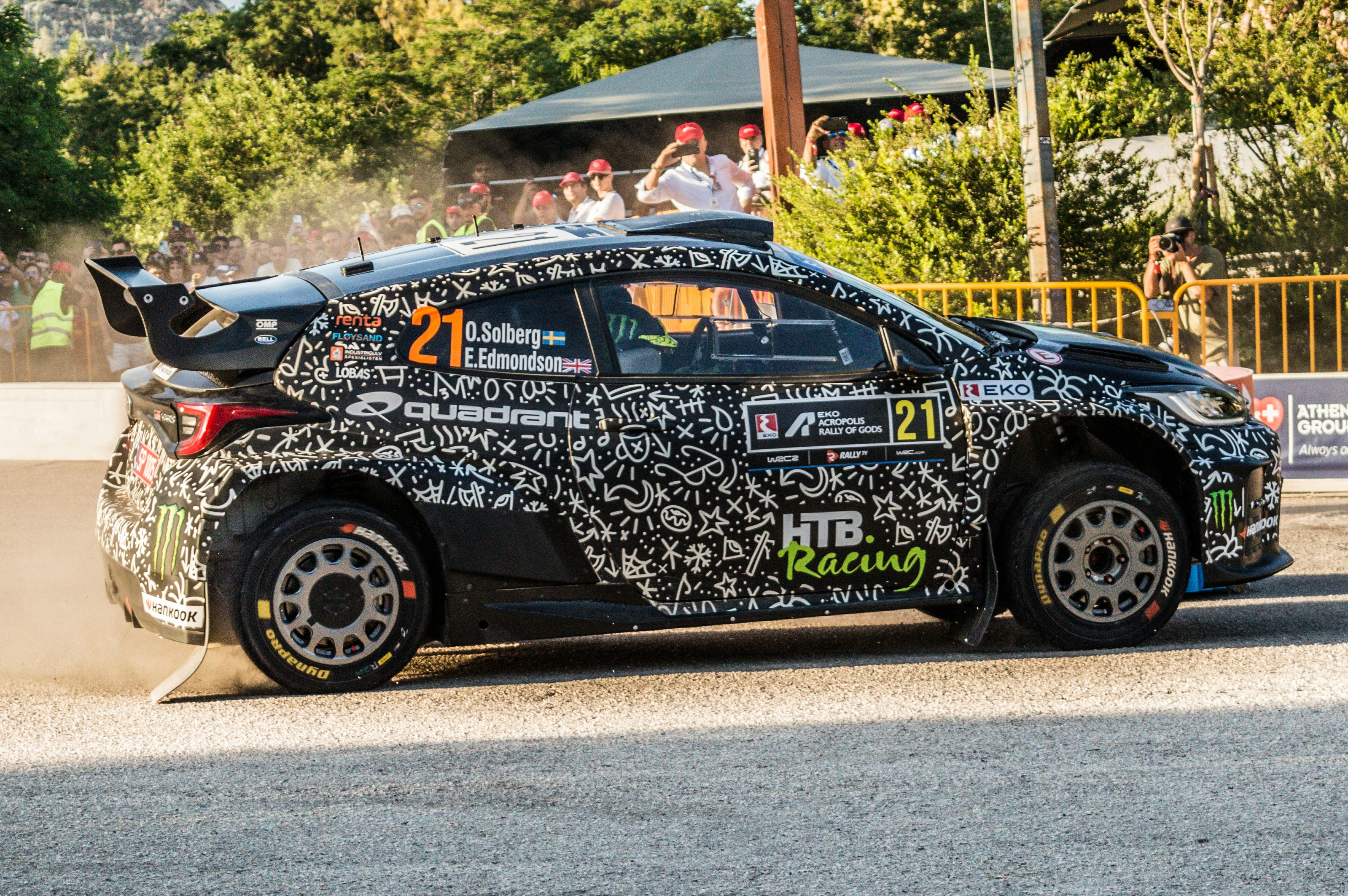 A rally car racing on the road.