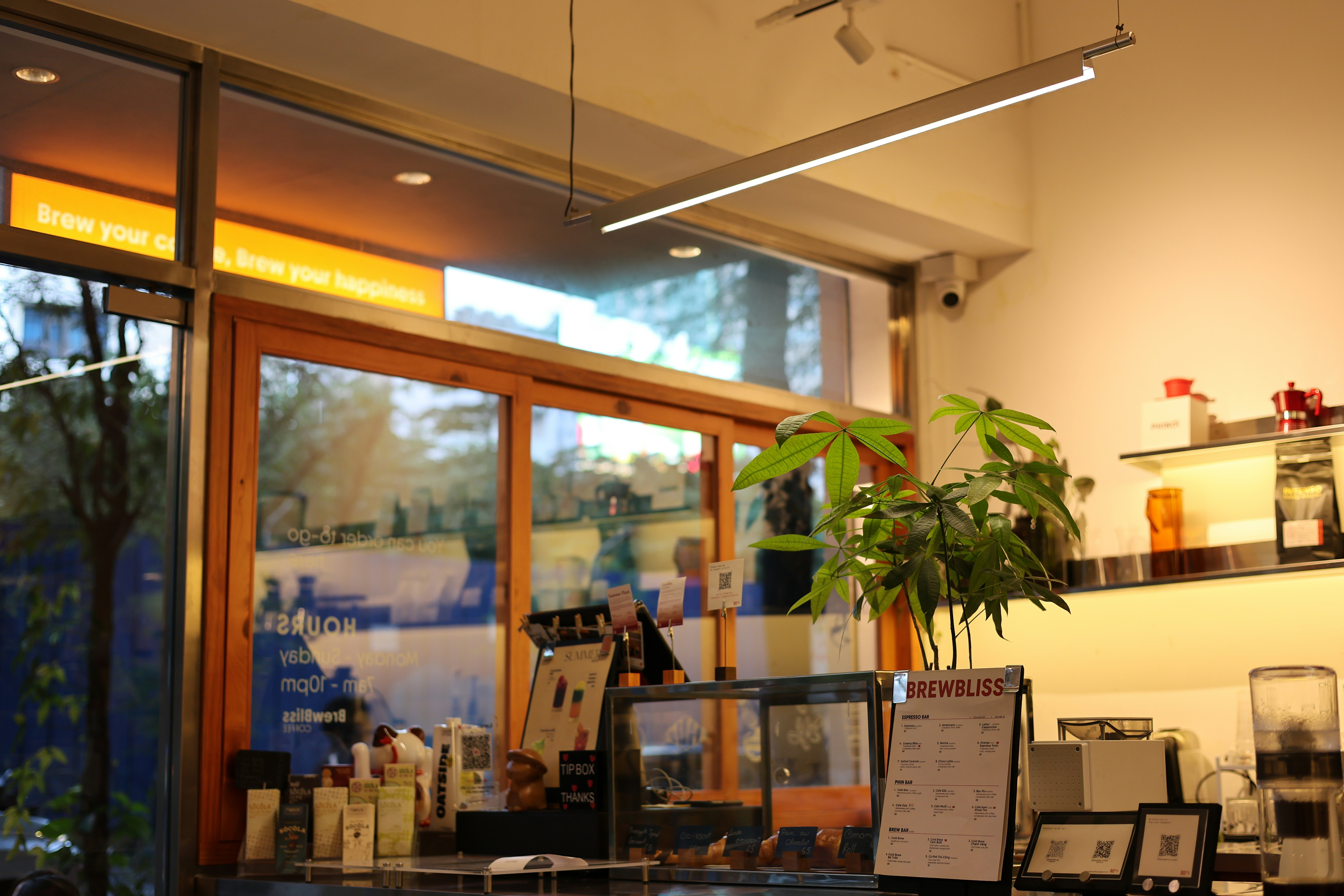 A coffee shop interior with bright lighting.