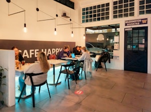 People sit and work inside a "cafe happy".