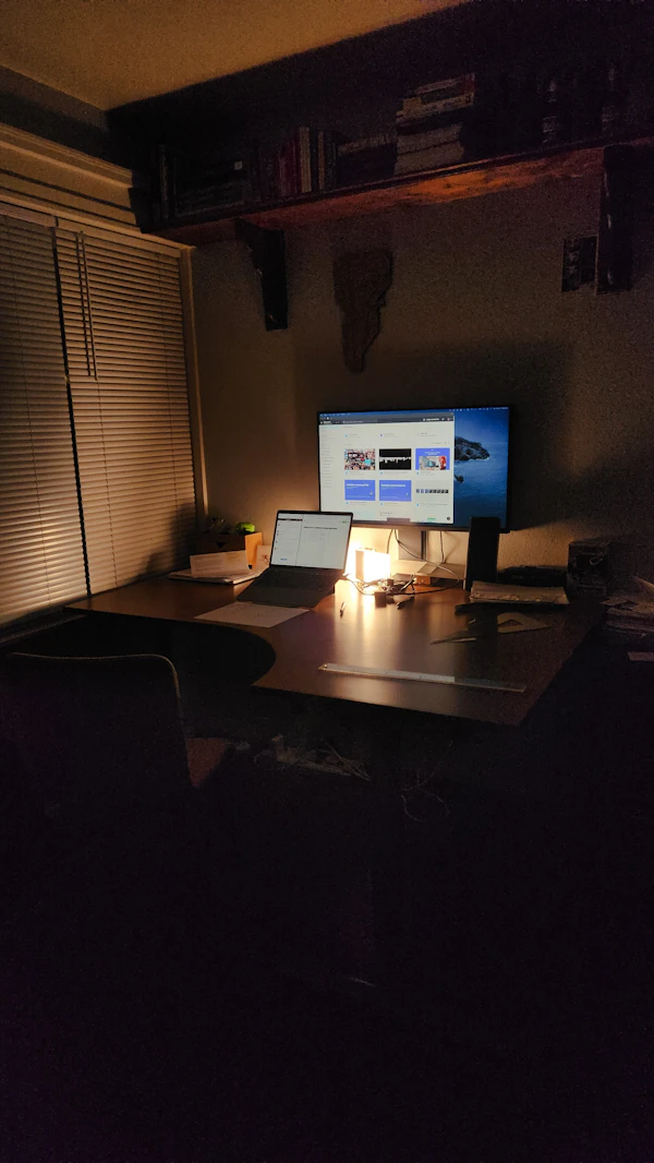 Dimly lit night-time desk workspace