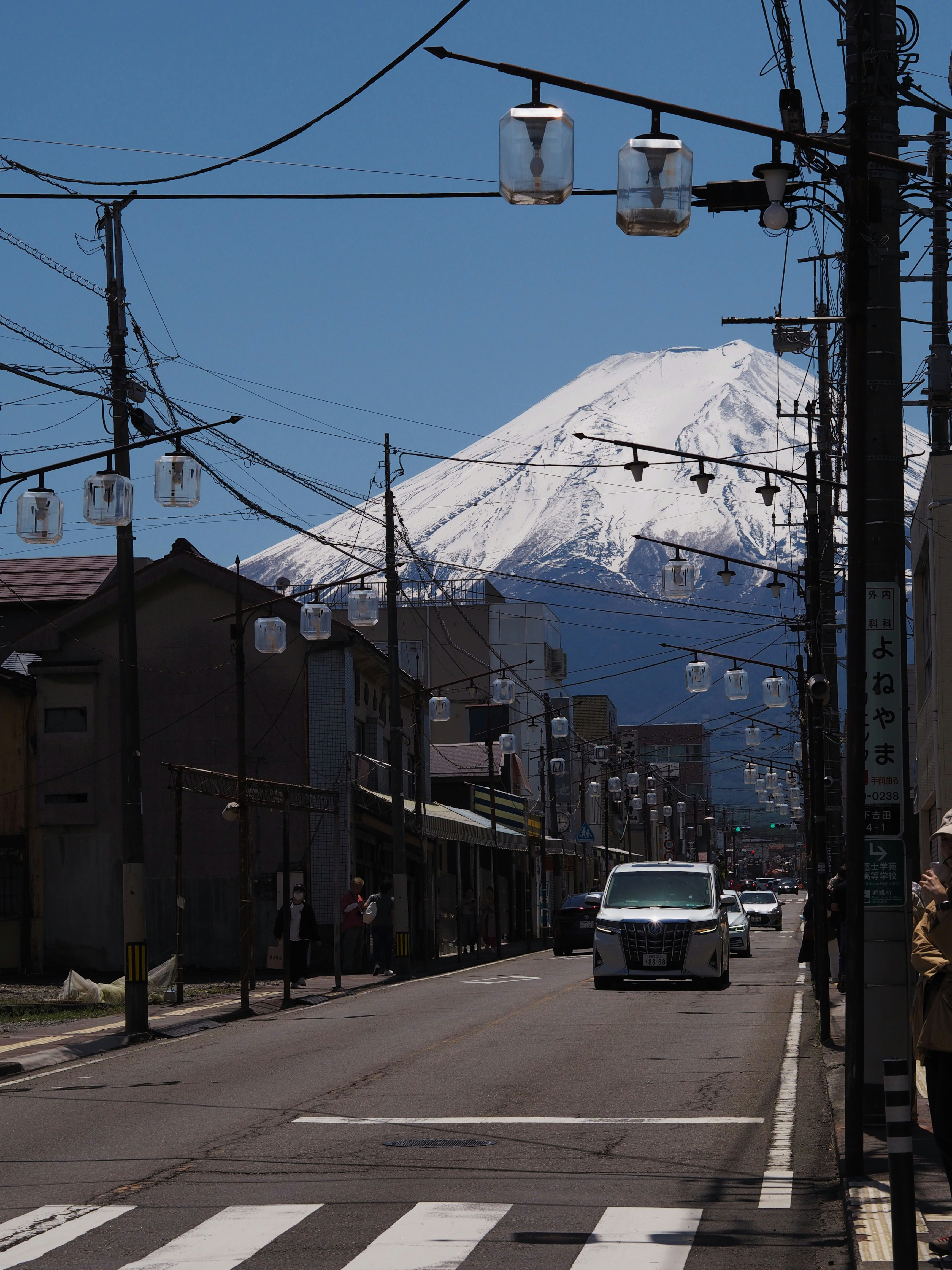 A street view of mount fuji on a sunny day.