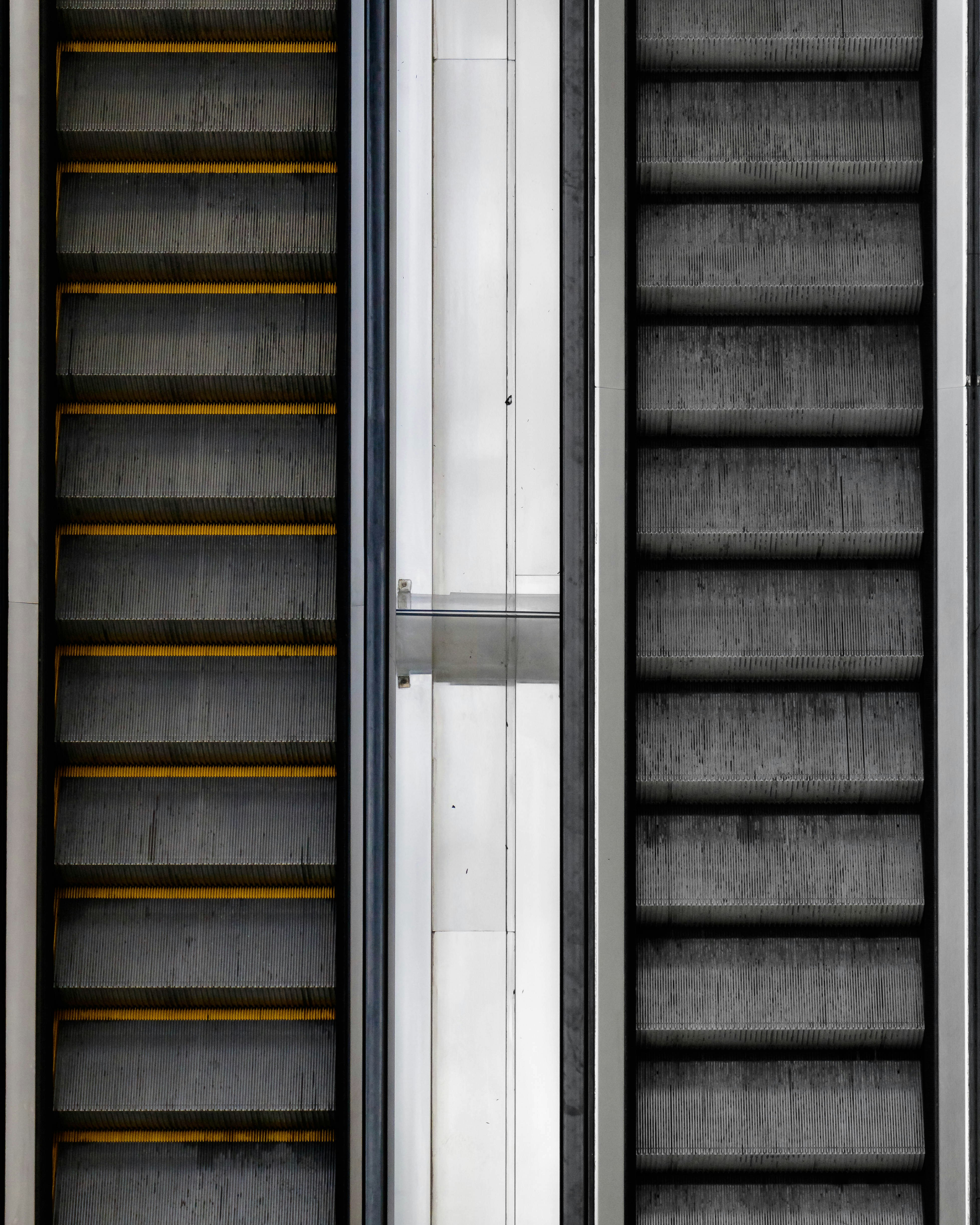 Escalators lead upwards in a modern building.