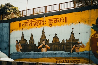 A mural depicts people and temples in the water.
