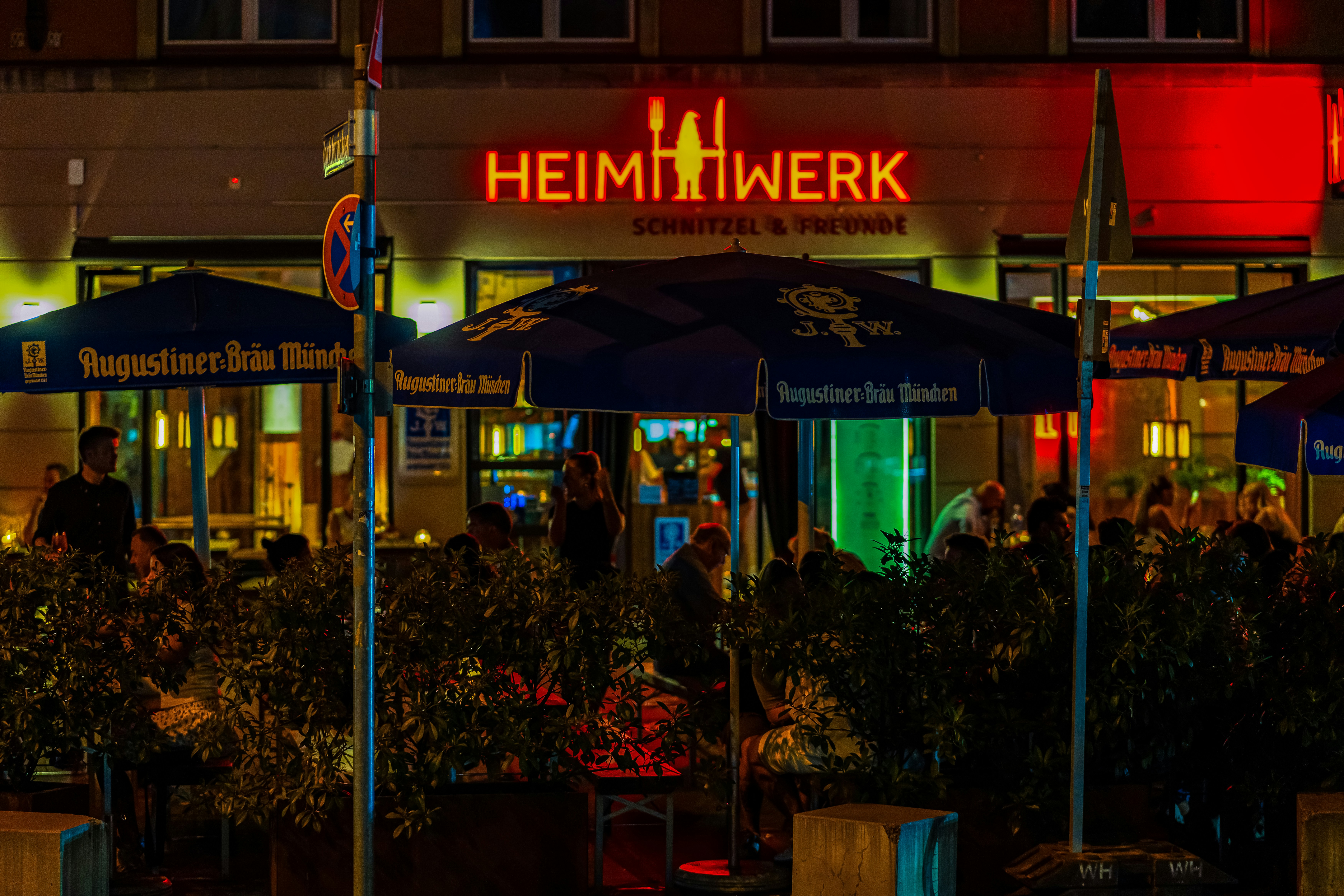 A restaurant called heimwerk at night.