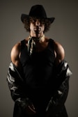 A man in cowboy hat and leather jacket.