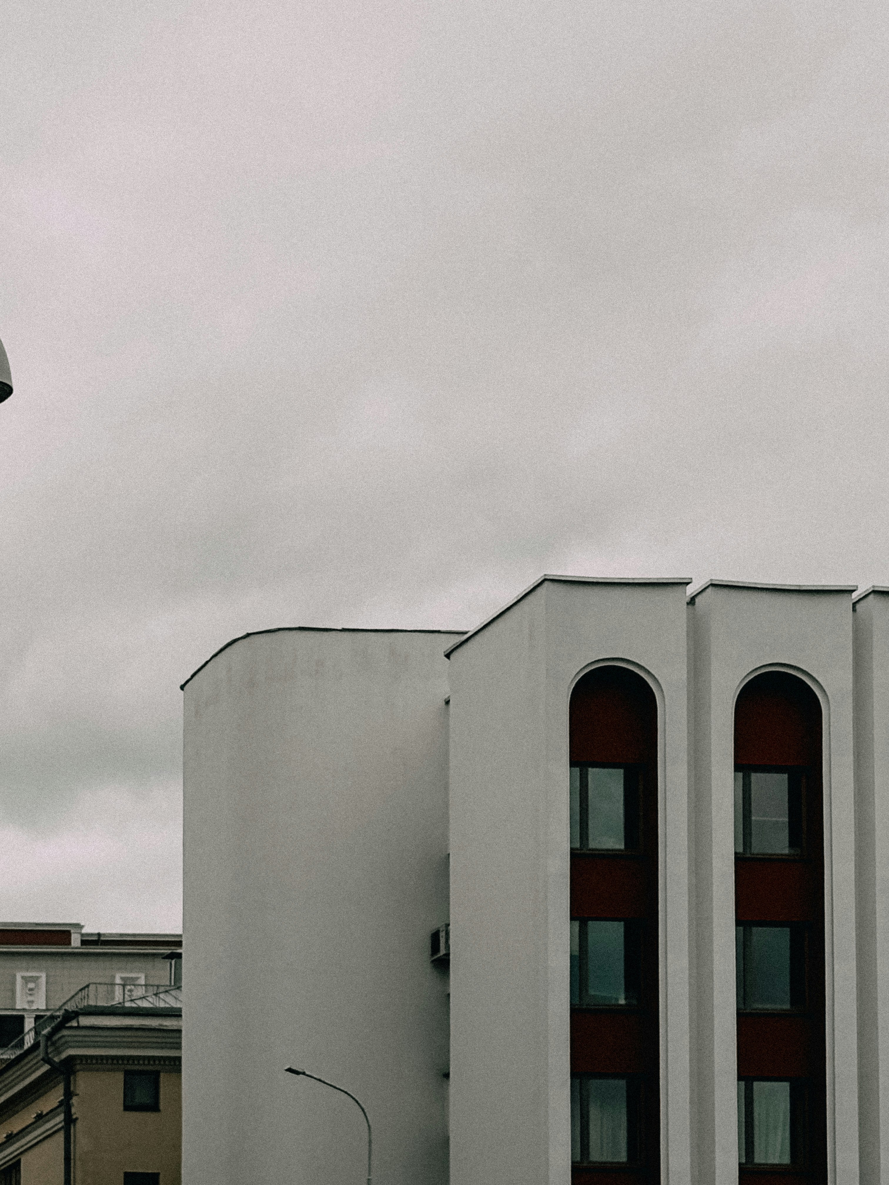 Buildings contrast with a gray sky on an overcast day.