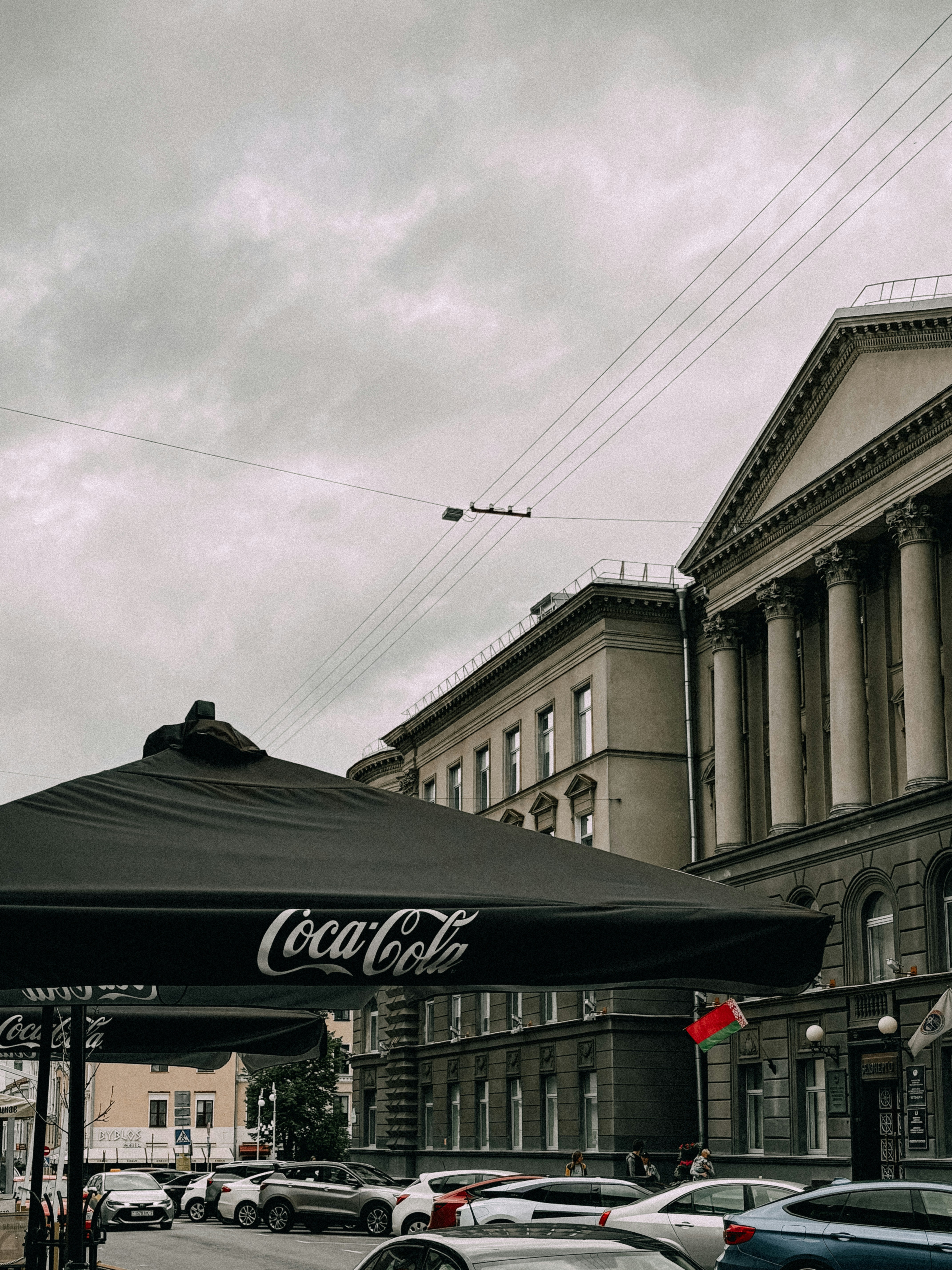 A street scene featuring buildings and coca-cola.