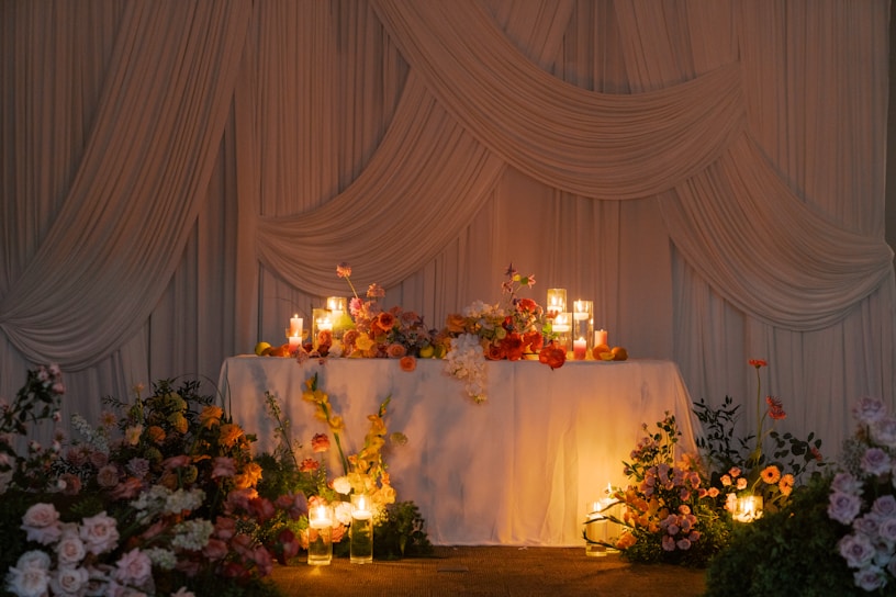 A beautiful wedding table with flowers and candles.