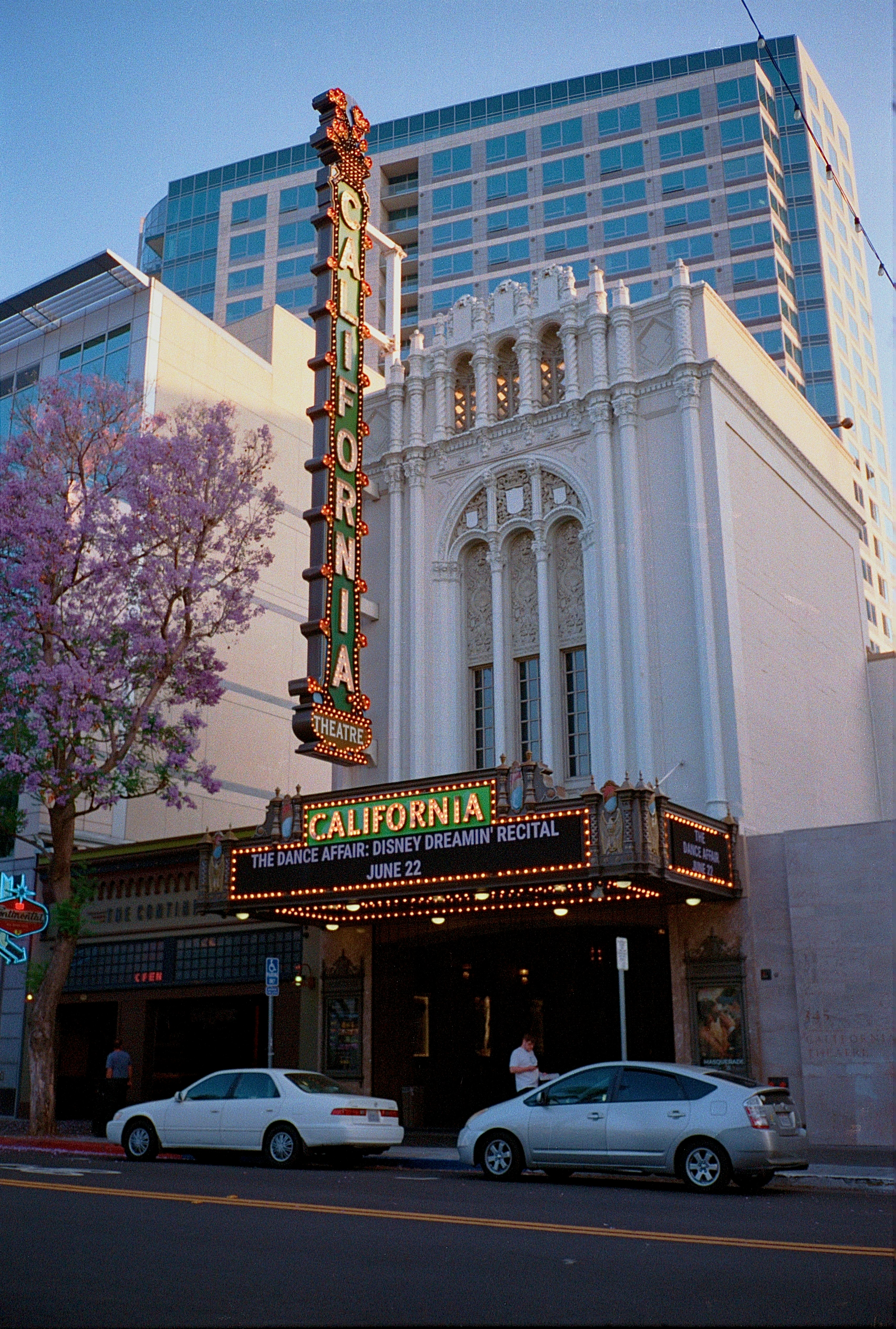 The california theatre sits on a city street.