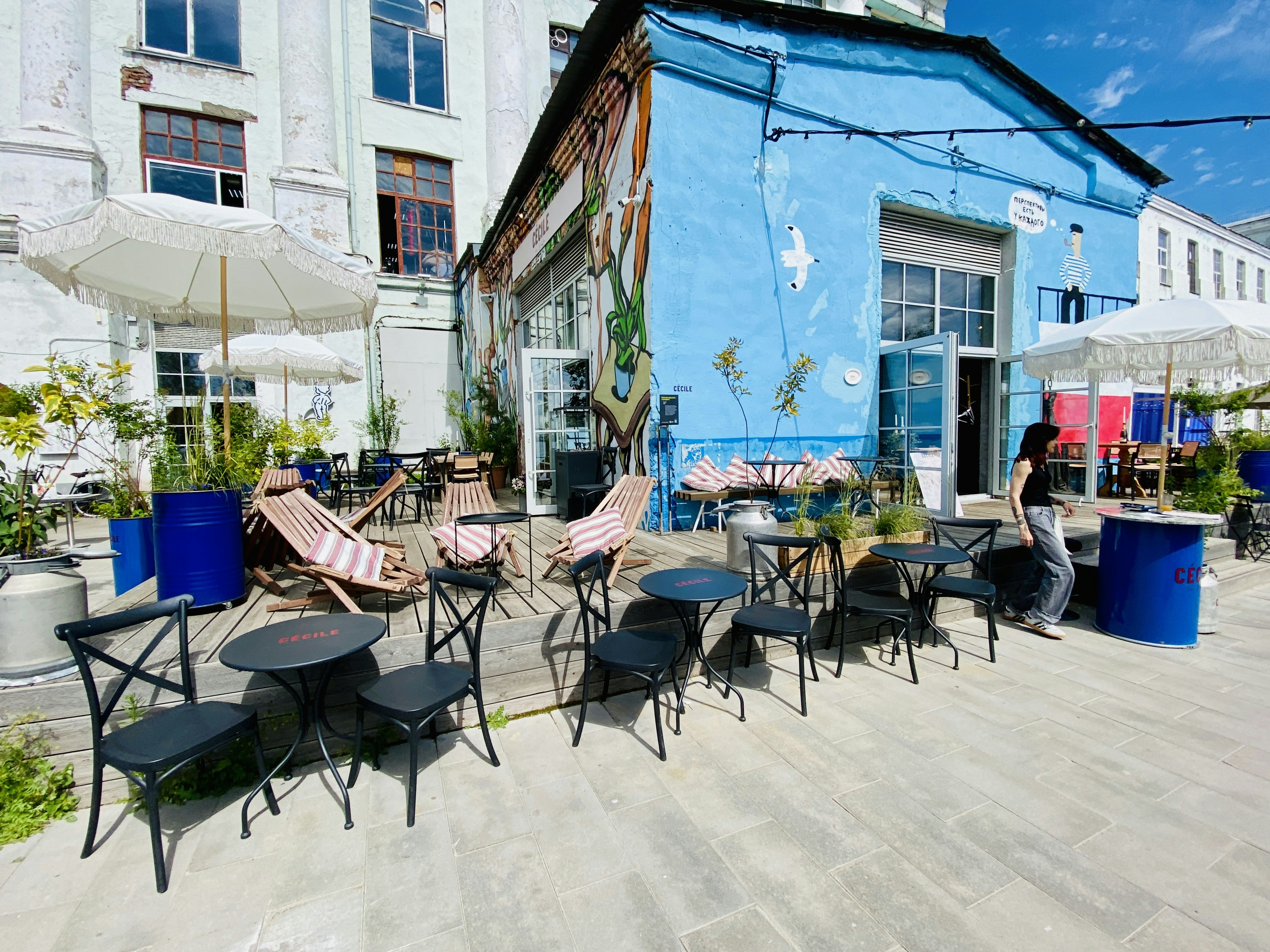 Outdoor cafe with chairs and tables.