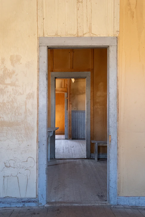 Open doorways lead to the inside of a building.