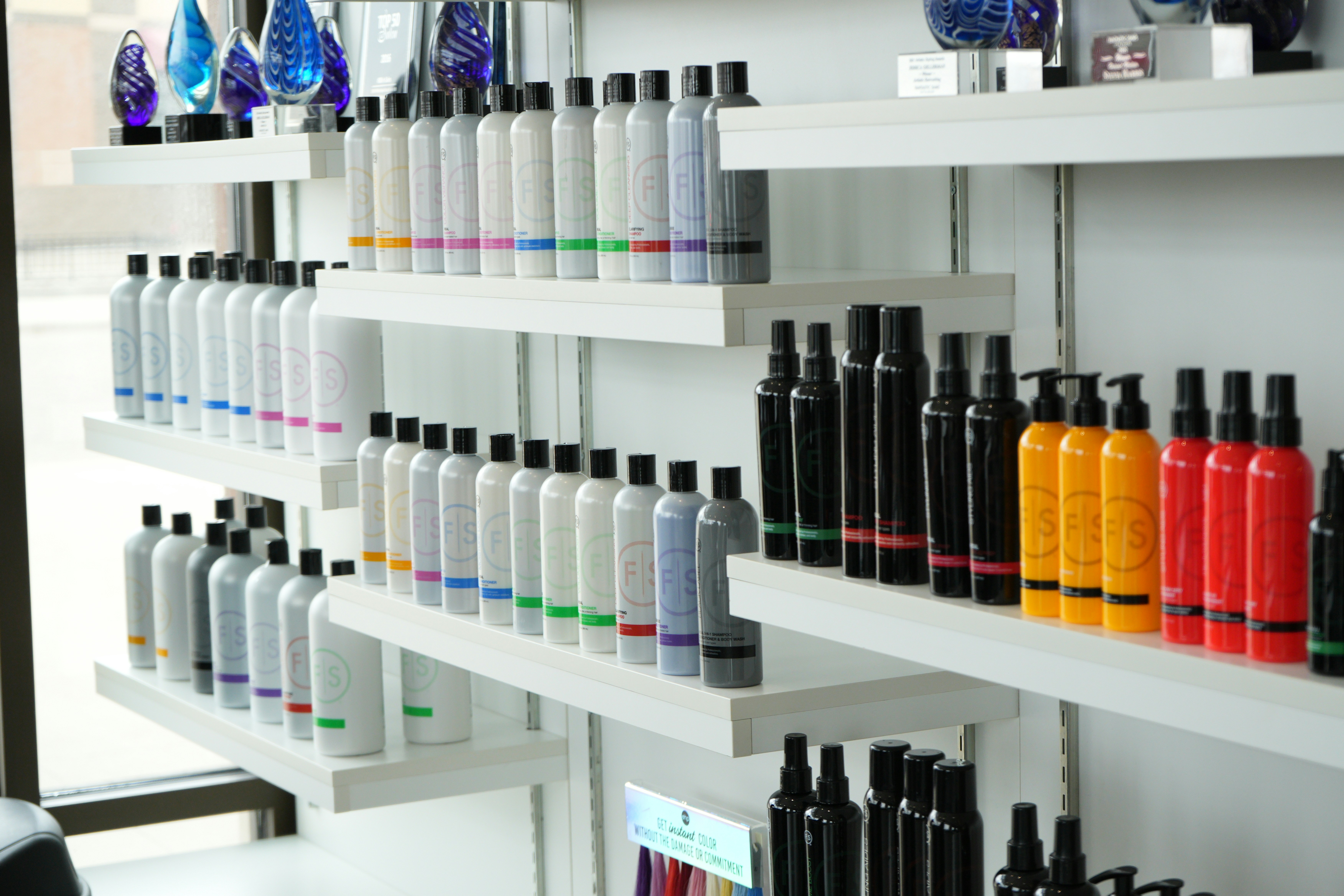 Hair products are neatly displayed on shelves.