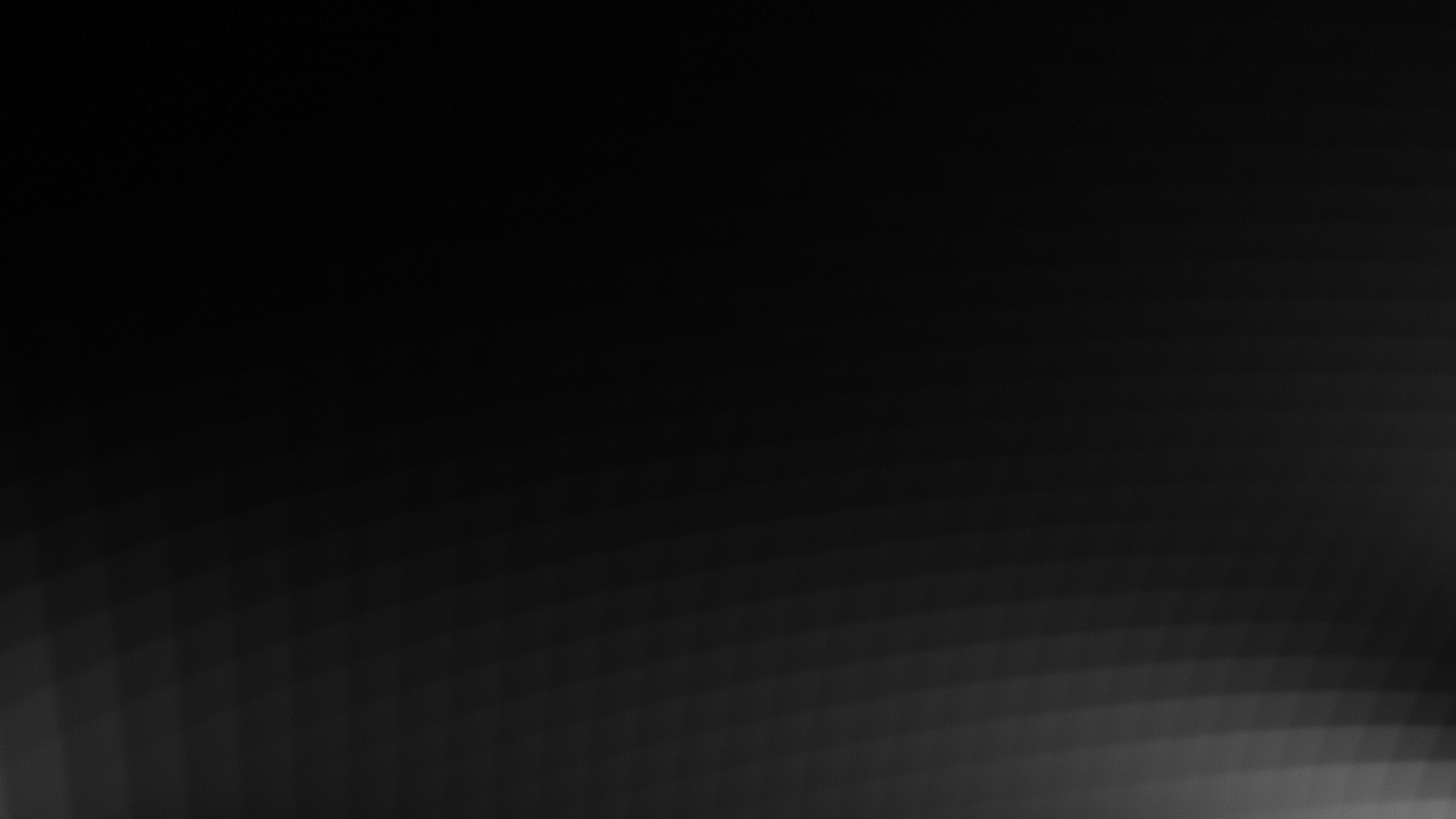 Abstract dark texture with light gradient.