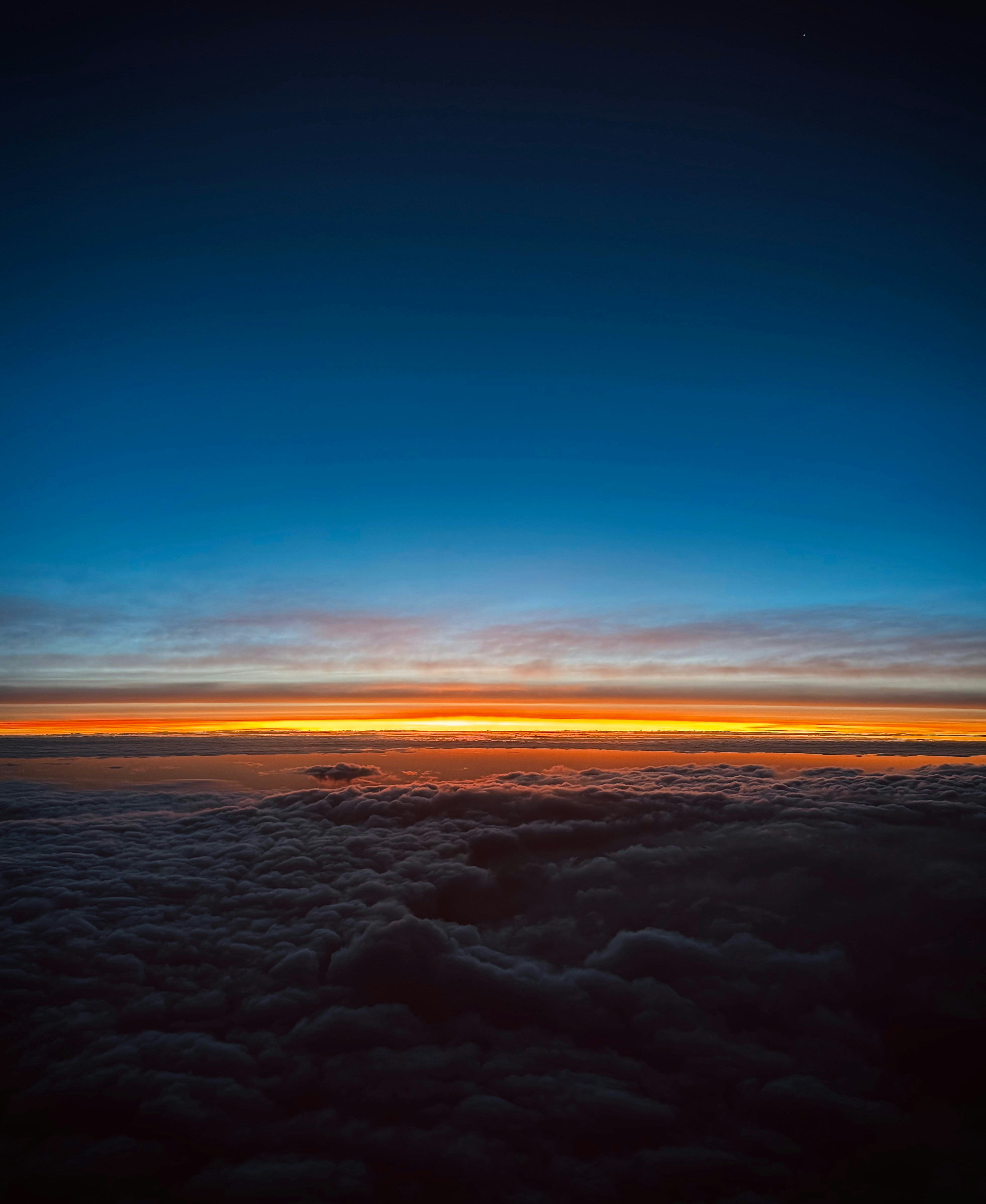 Sunset view above a sea of clouds.